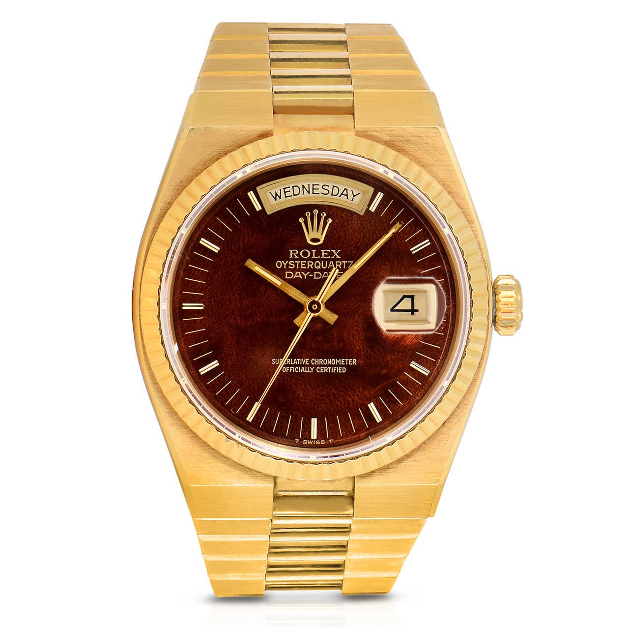Rolex Solid 18K Yellow Gold Oyster-Quartz Day-Date Presidential Watch
Features a Quartz Movement
Rare and Unusual Wood Dial
Integrated Solid 18K Yellow Gold Presidential Bracelet
Day and Date Functions
All Factory from Rolex 
Circa Early
