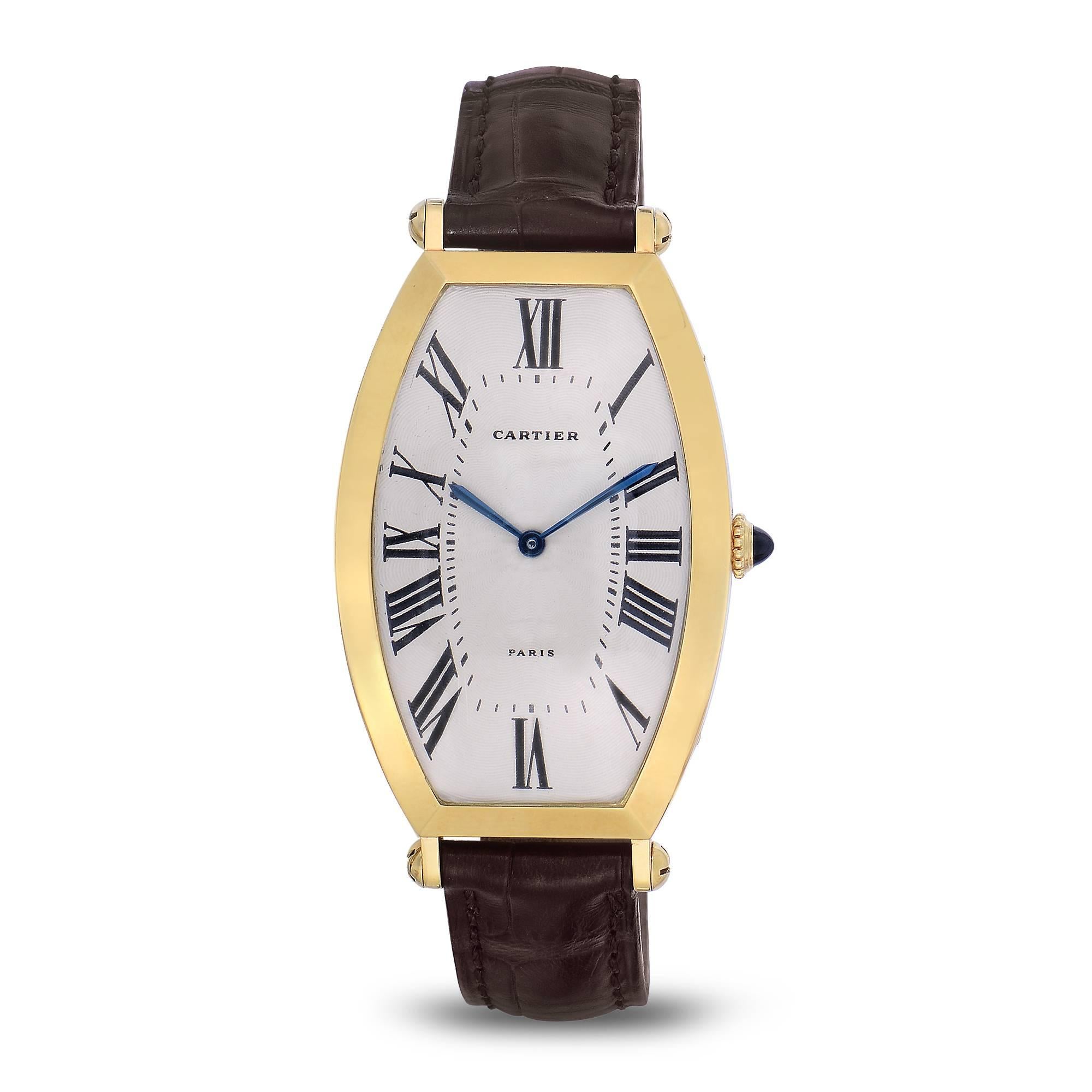Vintage Cartier Paris Solid 18K Yellow Gold Watch
Tonneau Shape
Manual Wind Movement
Beautiful Guilloche Dial with Roman Numerals
Classic Blue Cartier Hands
Signed and Engraved Case-Back
Classic Cartier Bullet Screw Lugs 
Cartier Blue
