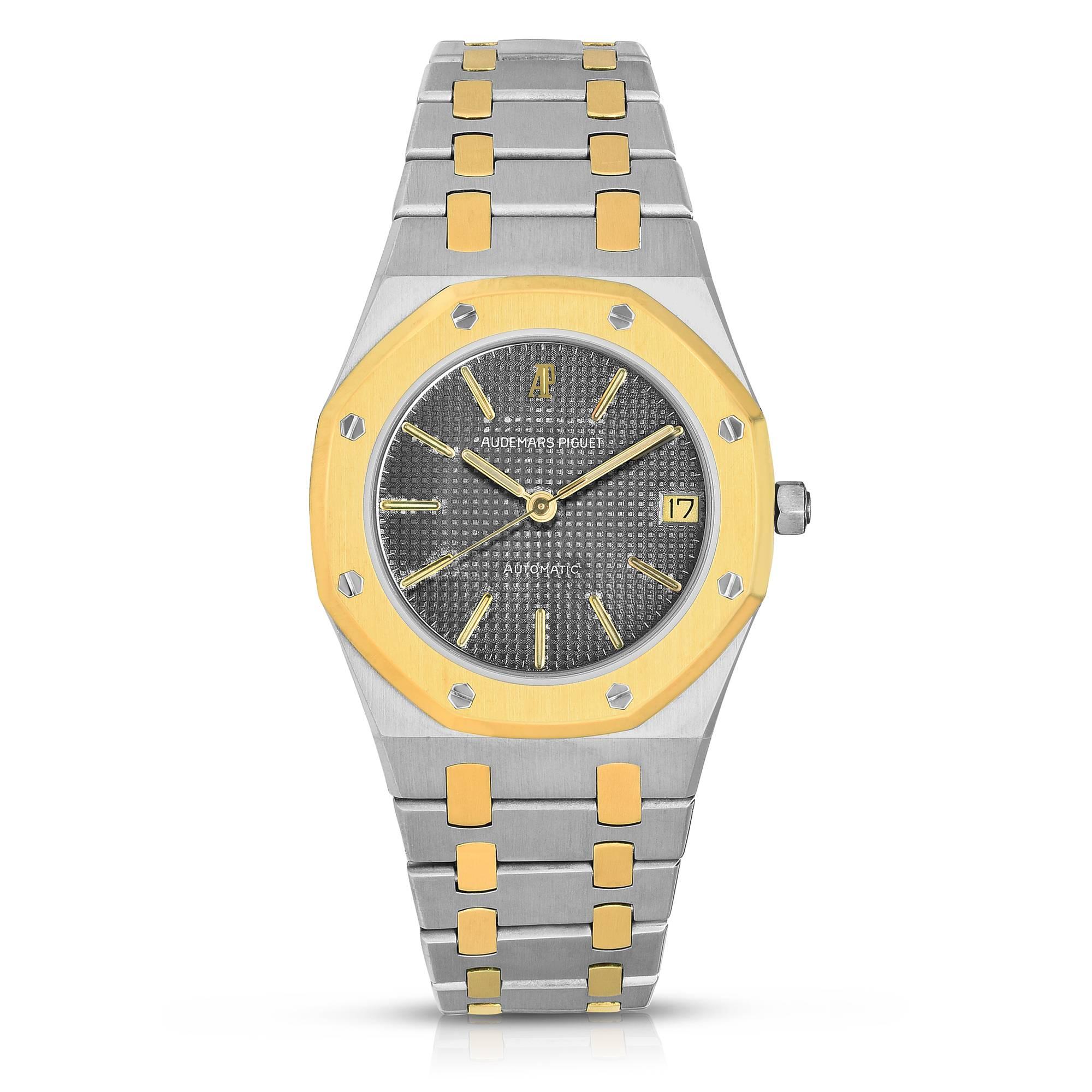 Audemars Piguet Royal Oak Automatic Watch
Stainless Steel and 18K Yellow Gold Case
Automatic Movement
Reference 4100 with Three Piece Case
18K Yellow Gold Octagonal Bezel
35mm in size 
Signed 18K Yellow Gold Screw-Down Crown
Sapphire