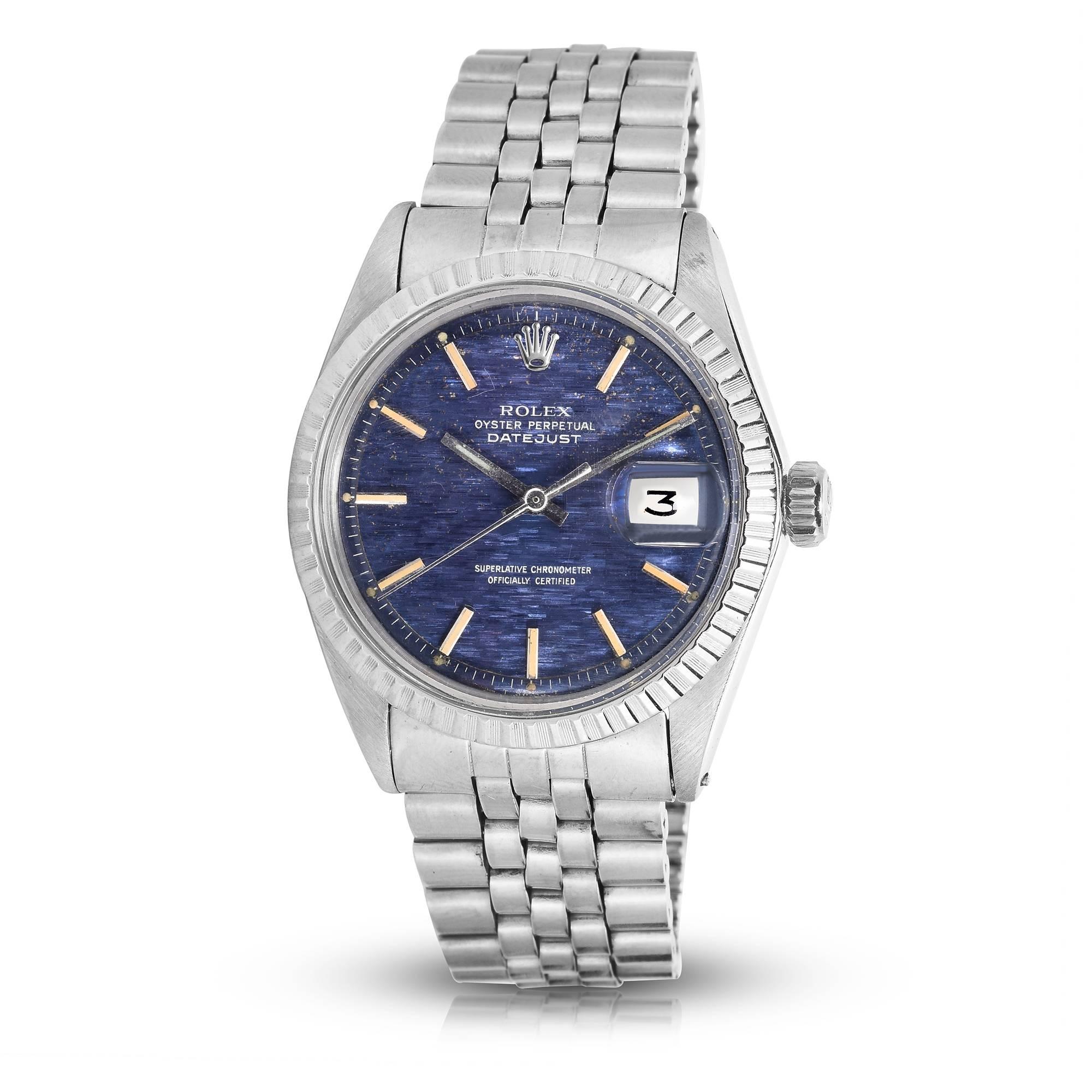 Rolex Stainless Steel Oyster Perpetual Datejust
Rare Blue Wave Dial with Applied Hour Markers with Patina
A True One Of A Kind Watch 
Stainless Steel Engine-Turned Bezel
36mm in size 
Plastic Crystal
From 1970
Comes Fitted on A Rolex