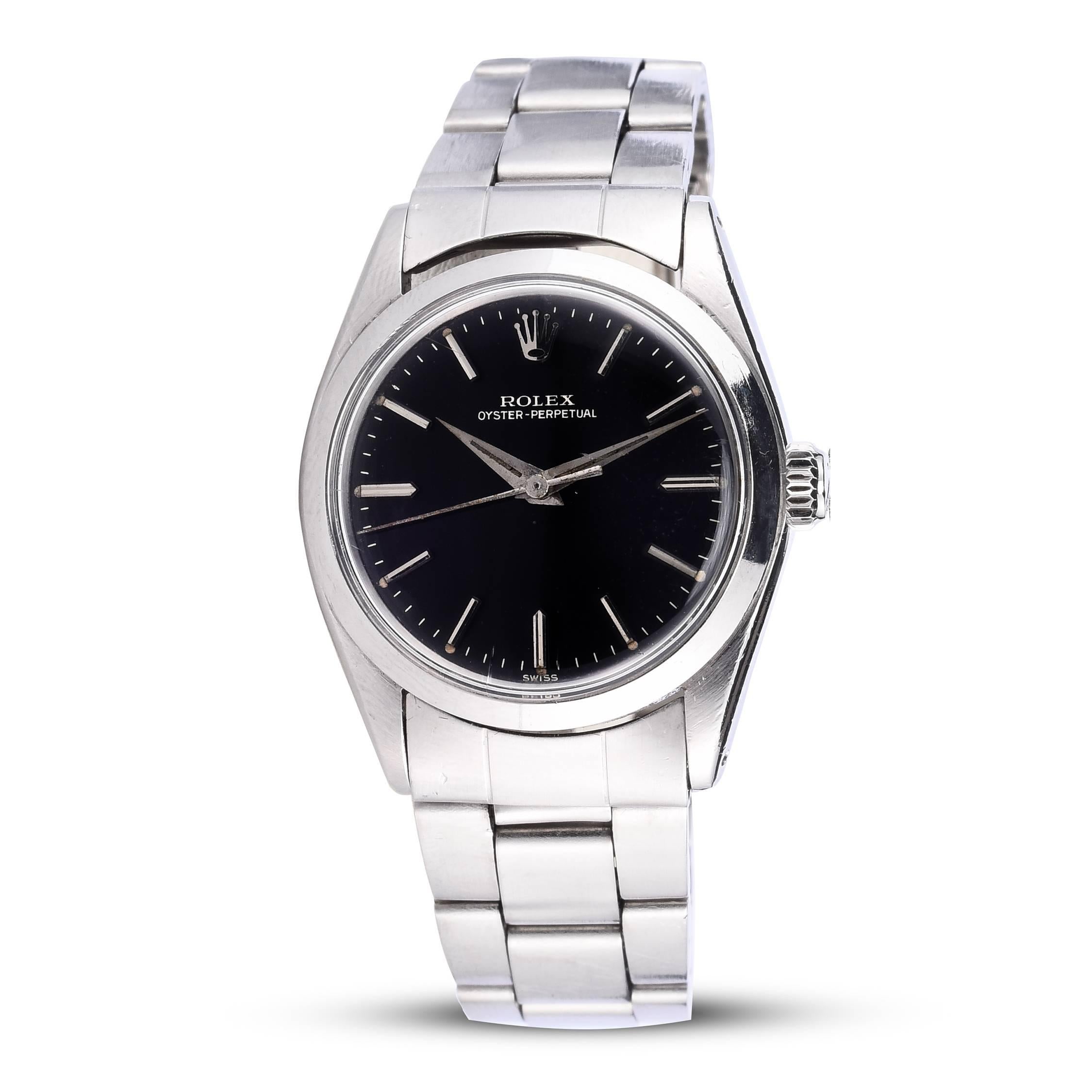 Rolex Stainless Steel Oyster Perpetual Watch
Rare 31mm Midsize Model 
Beautiful Black Swiss Gloss Dial with Gilt Writing 
Smooth Stainless Steel Bezel
Dauphine Hands
Features Original Rolex Automatic Movement 
Plastic Crystal
From Early