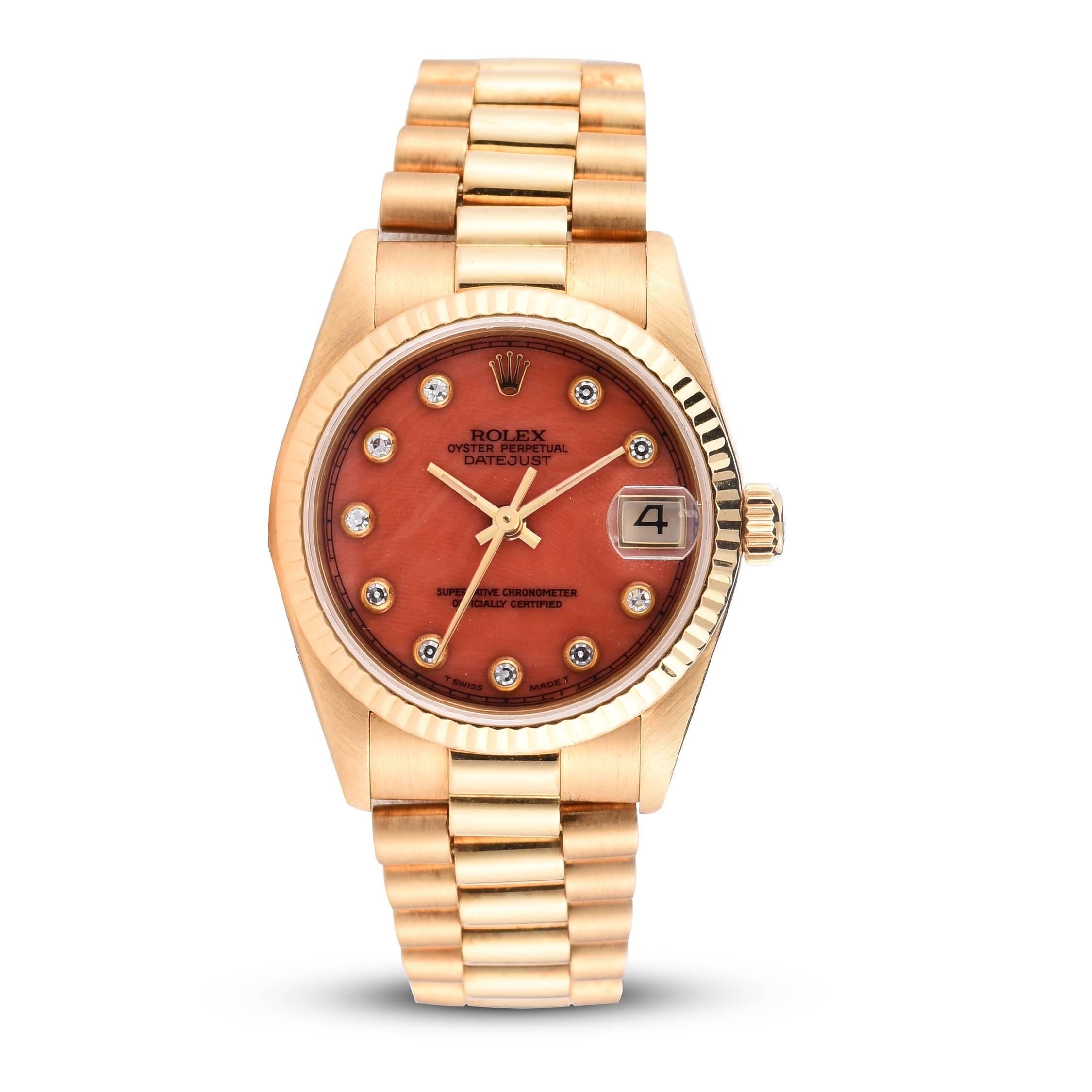 Rolex 18K Yellow Gold Midsize Oyster Perpetual Datejust President Watch
Features an Extremely Rare Factory Coral and Bezel Set Diamond Dial
18K Yellow Gold Case
18K Yellow Gold Fluted Bezel
Rolex Automatic Quick-Set Movement
Date at Three