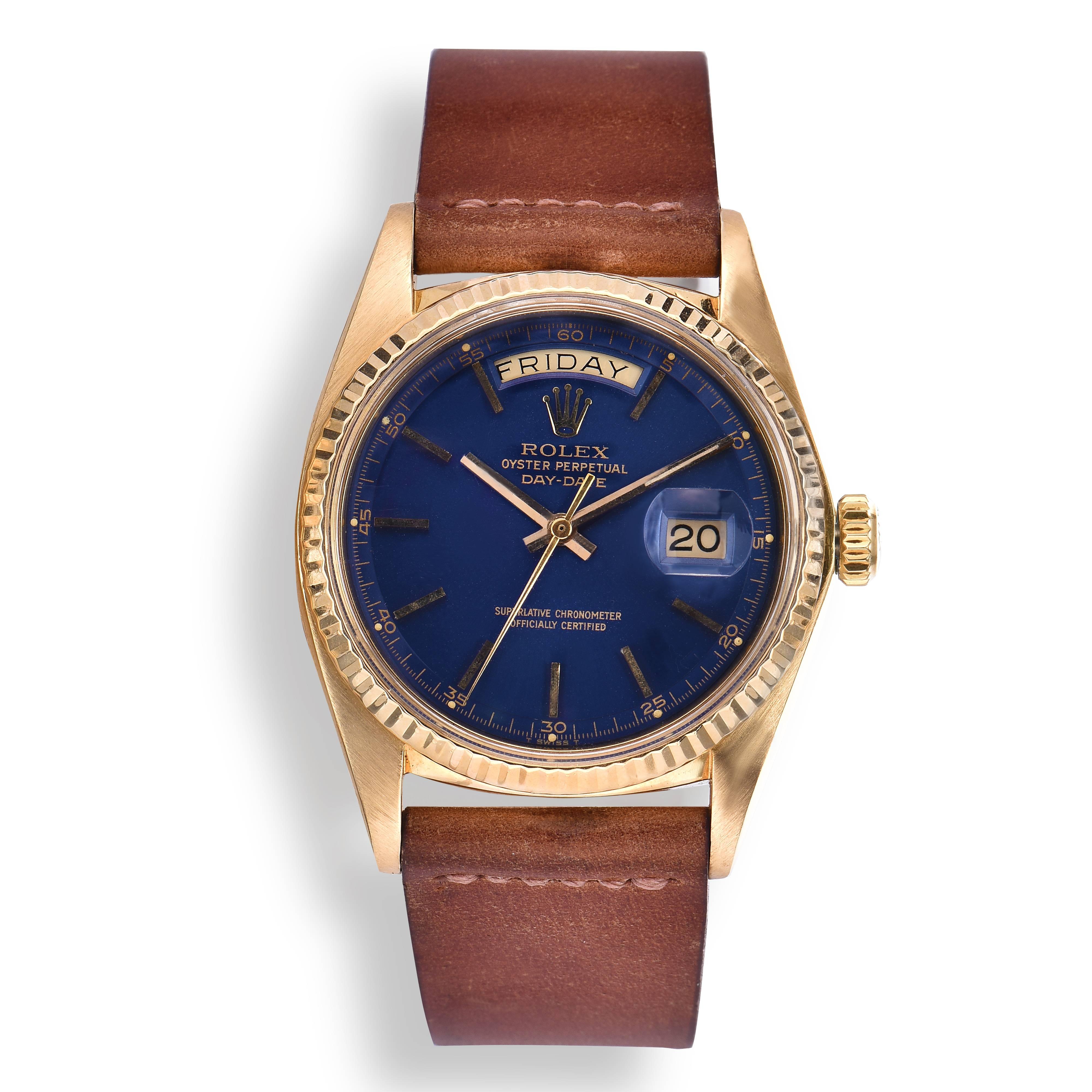 Rolex 18K Yellow Gold Oyster Perpetual Day-Date Watch
Features a Stunning Blue Gloss Dial with Gold Applied Stick Markers
Matching Gold Hands
Day and Date Functions
Fluted 18K Yellow Gold Bezel
36mm in size 
Features Rolex Automatic Movement