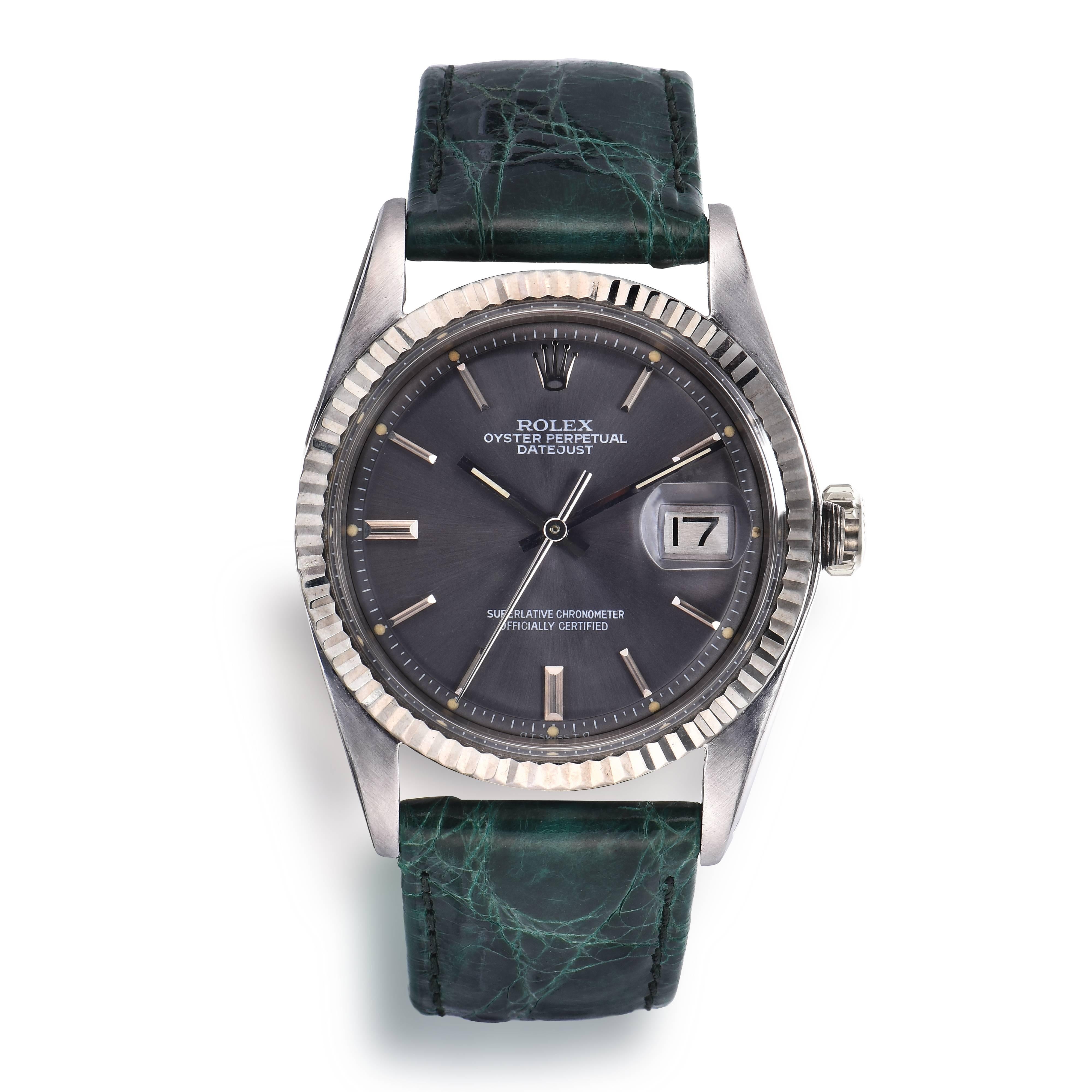 Rolex Stainless Steel and White Gold Oyster Perpetual Datejust Watch
Beautiful Factory Grey Taupe 'Sigma' Pie-Pan Dial
18K White Gold Fluted Bezel
Stainless Steel Case
36mm in size 
Features Rolex Automatic Movement with Calibre 1500