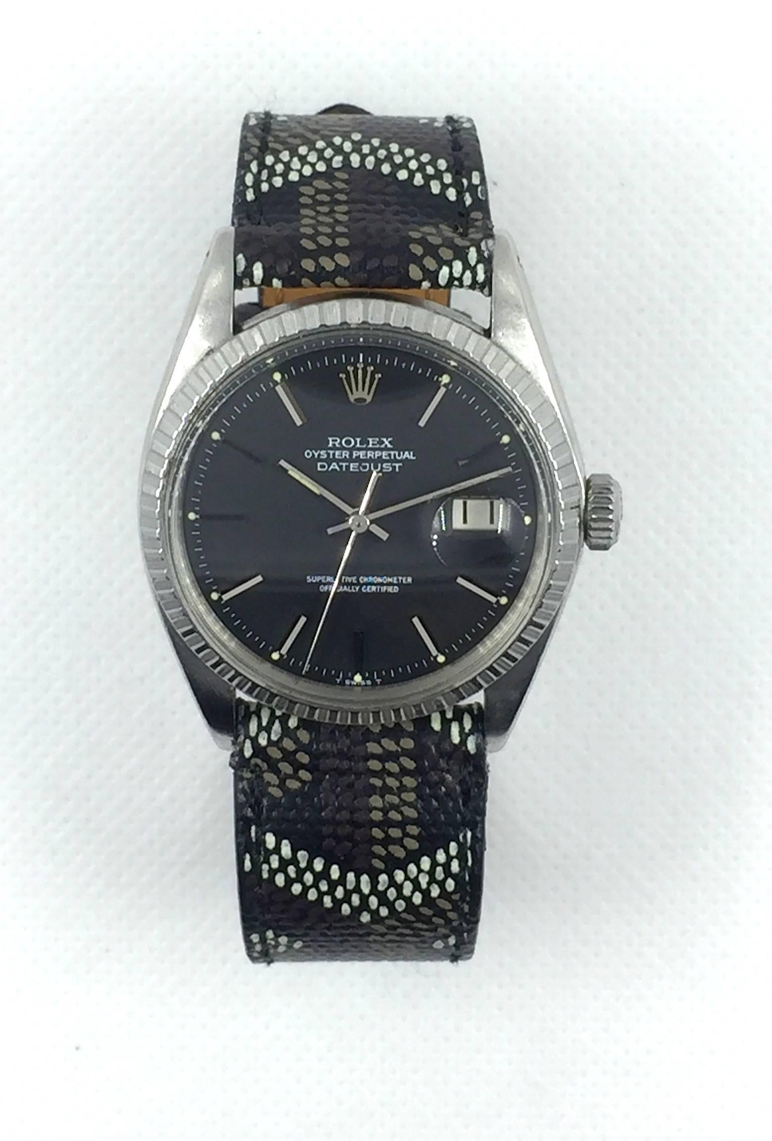 Rolex Stainless Steel Oyster Perpetual Datejust Wristwatch
Factory Black Matte Dial with Silver Applied Hour Markers
Stainless Steel Engine Turned Bezel
36mm in size 
Rolex 1500 Base Calibre Automatic Movement
Acrylic Crystal
Early 1970s