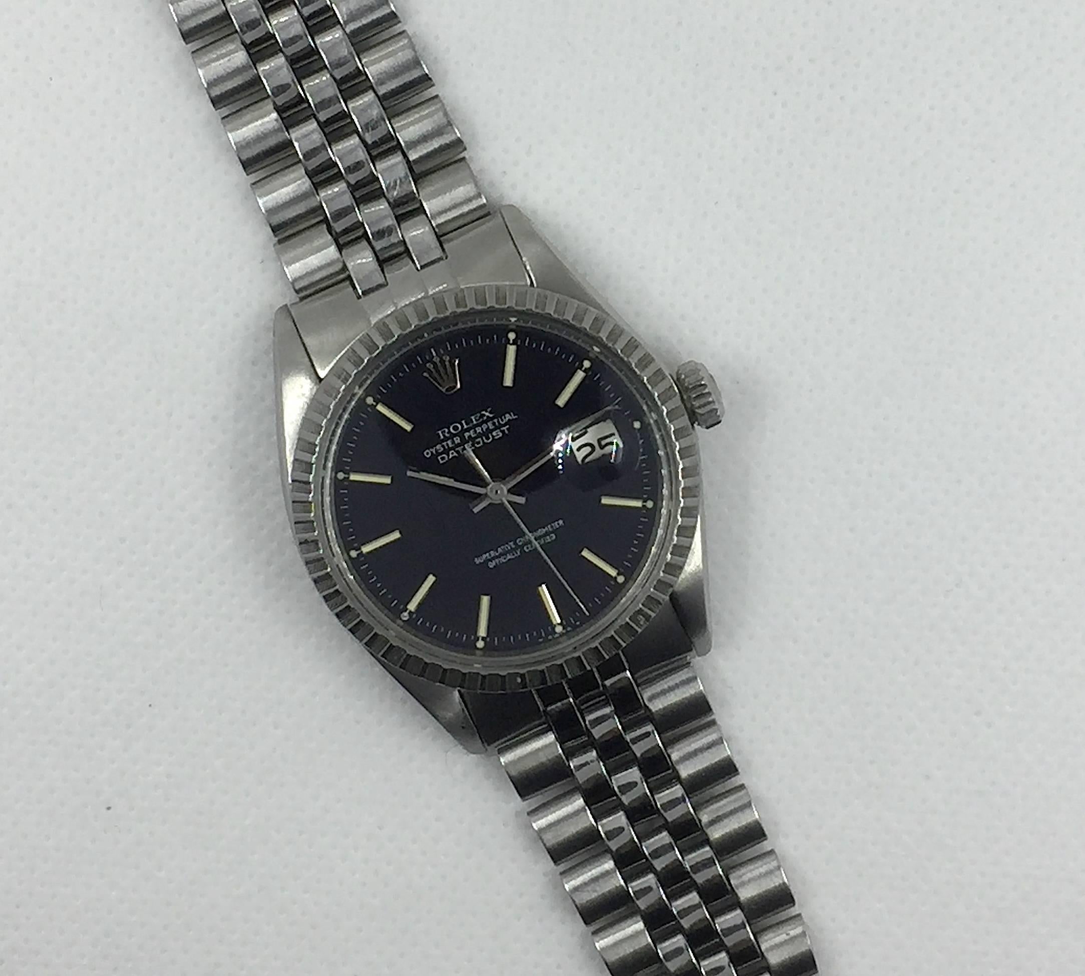 Rolex Stainless Steel Oyster Perpetual Datejust Wristwatch
Factory Black Matte Dial with White Applied Markers
Stainless Steel Engine Turned Bezel
36mm in size 
Rolex 1500 Base Calibre Automatic Movement
Acrylic Crystal
Early 1970's Production
Comes