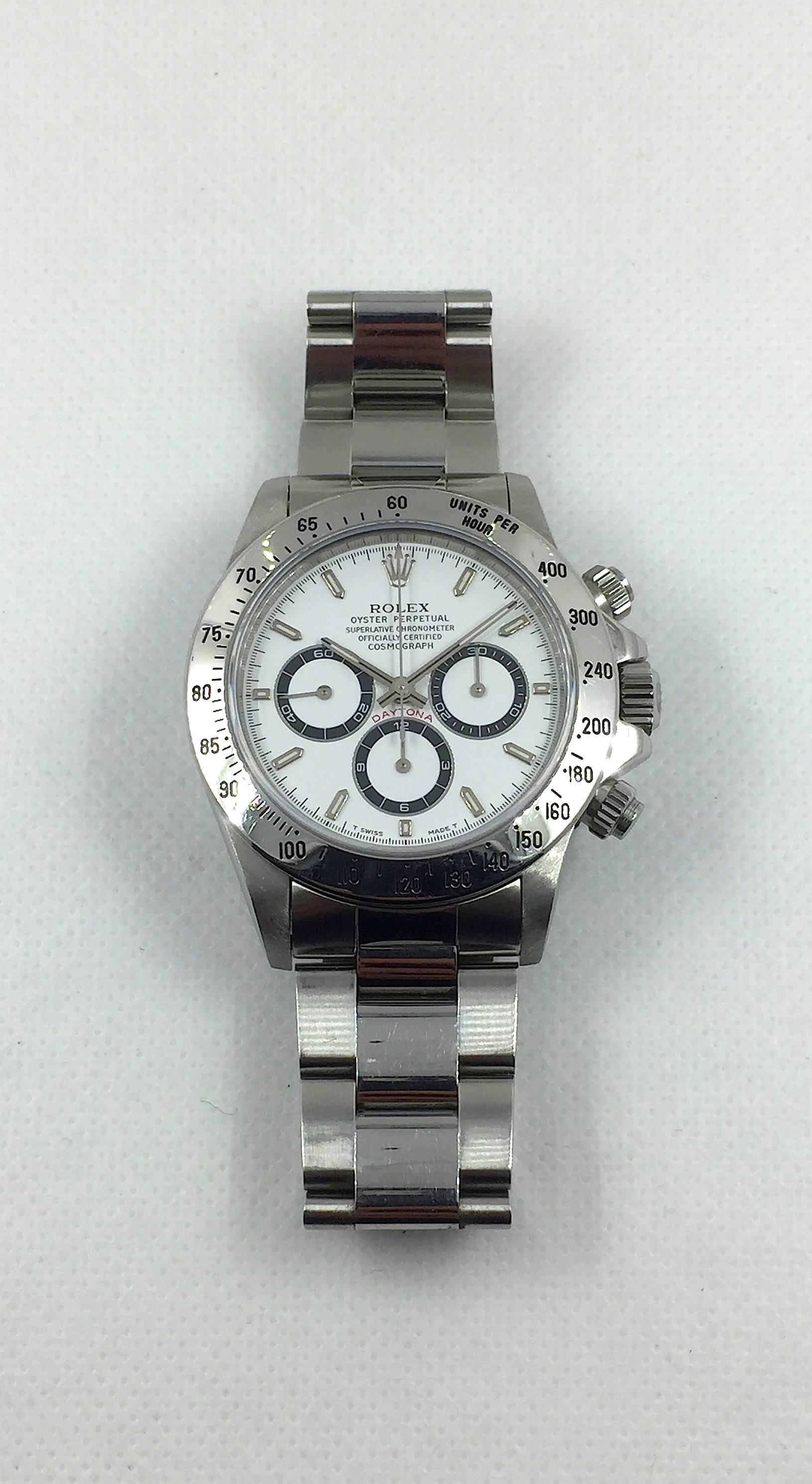 Rolex Stainless Steel Oyster Perpetual Daytona Cosmograph Watch
Superlative Chronometer Officially Certified
Factory White Dial with Black Subdials 
Chronograph Functions
Screw Down Crowns
Smooth Stainless Steel Tachymeter Bezel
40mm in size