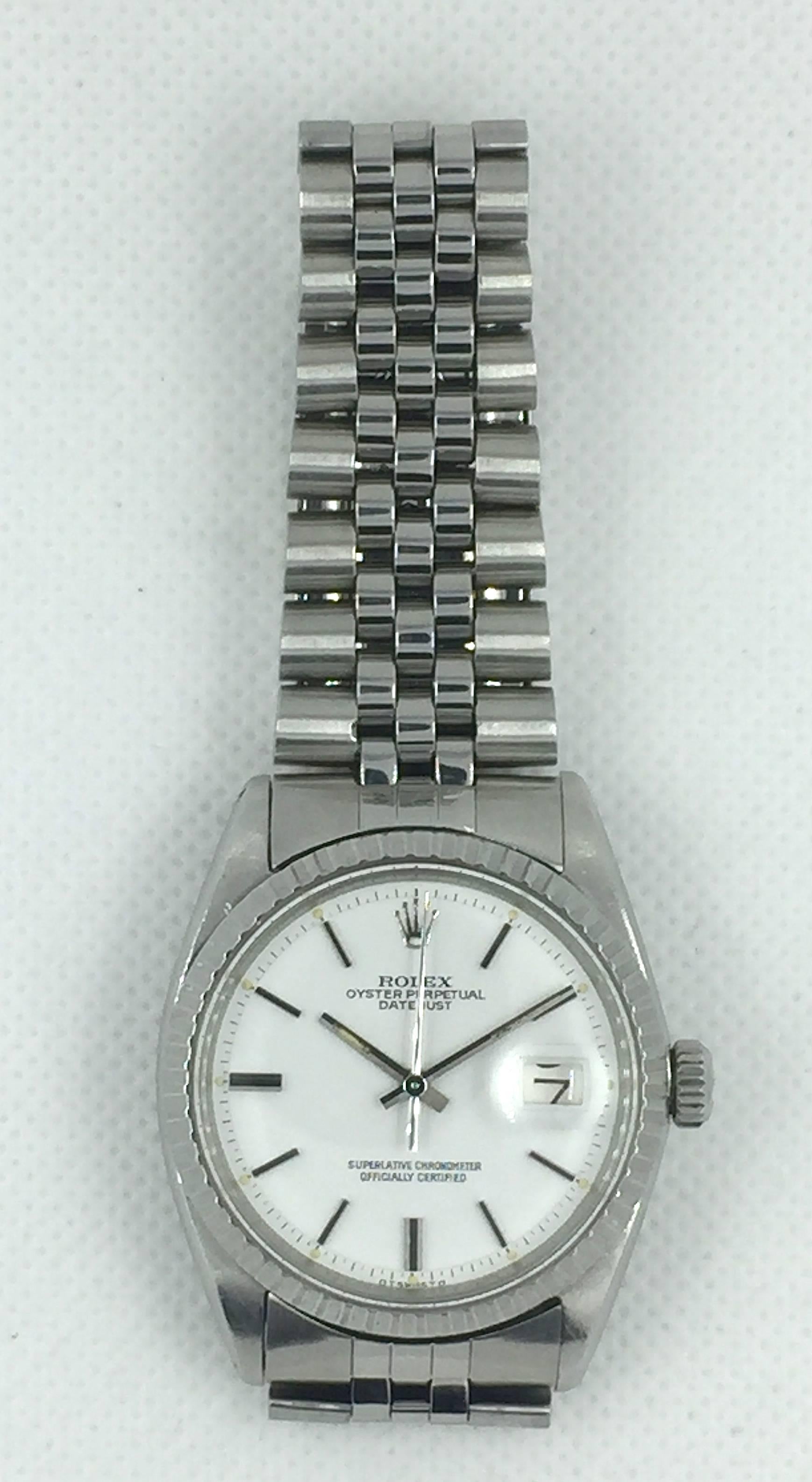 Rolex Stainless Steel Oyster Perpetual Datejust Wristwatch
Factory 'Snow-White' Sigma Dial with Applied Hour Markers
Stainless Steel Engine-Turned Bezel
36mm in size 
Rolex Calibre Base 1500 Automatic Movement
Acrylic Crystal
Late 1960's