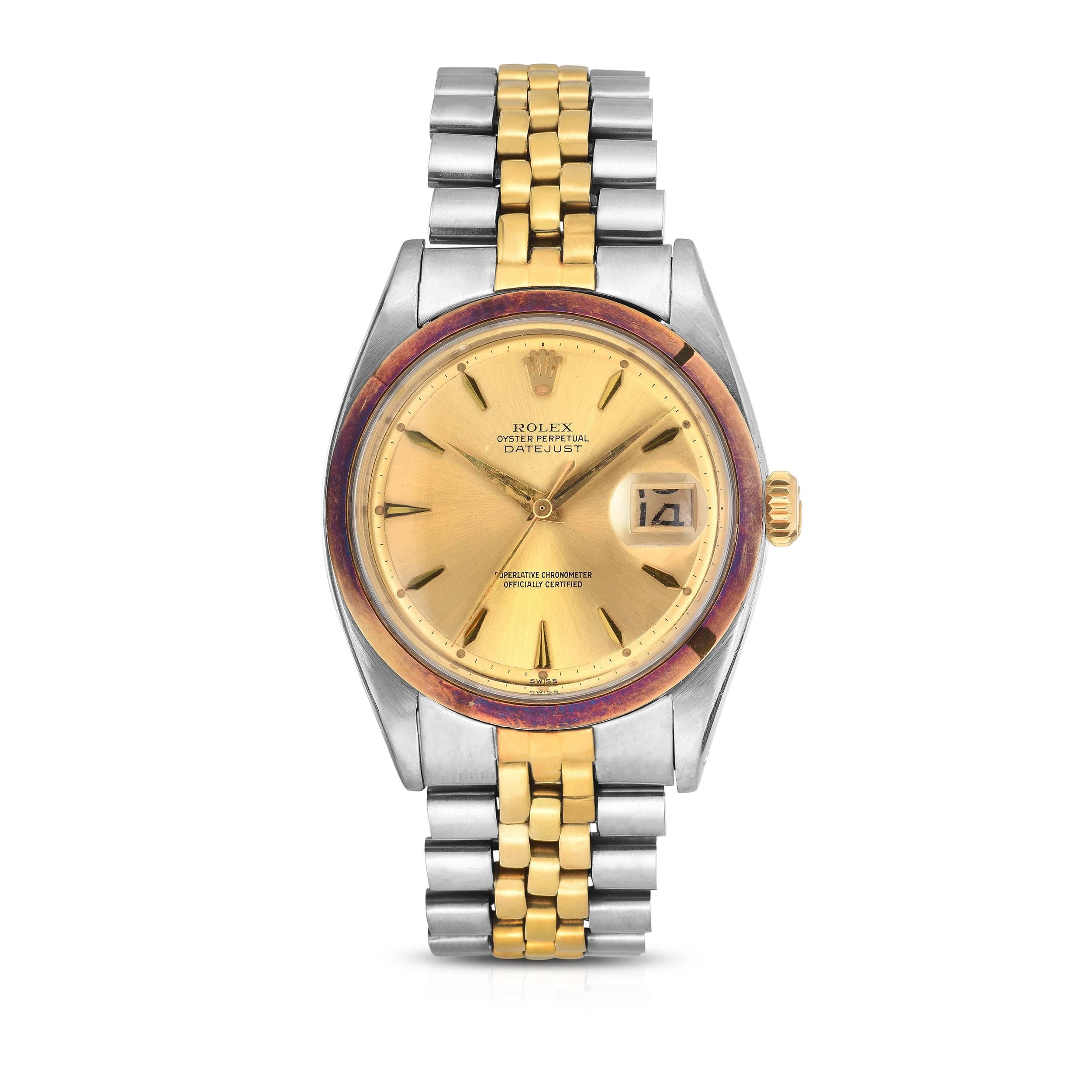 Rolex Stainless Steel and Oyster Perpetual Datejust Watch
Beautiful Factory Champagne 'swiss' dial with Applied Dagger Hour Markers and Matching Dauphine Hands
18K Yellow Gold Smooth Bezel with  Rainbow Appearence from Oxidation
Bezel and Case are