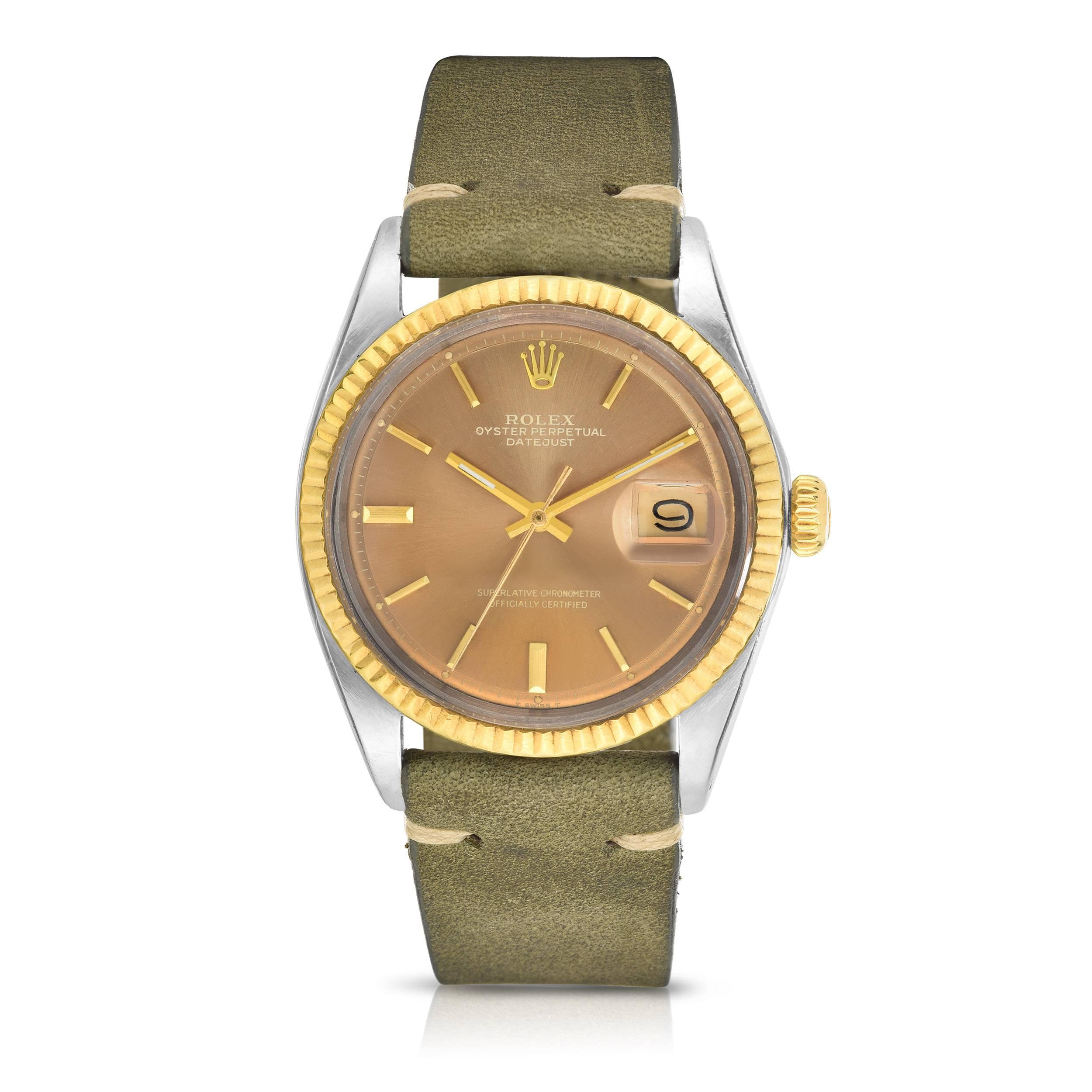 Rolex Stainless Steel and Yellow Gold Oyster Perpetual Datejust Watch
Beautiful Factory Golden Grey 'Pie-Pan' Dial with Applied Hour Markers
Yellow Gold Gold Fluted Bezel
Stainless Steel Case
36mm in size 
Features Rolex Automatic Movement with