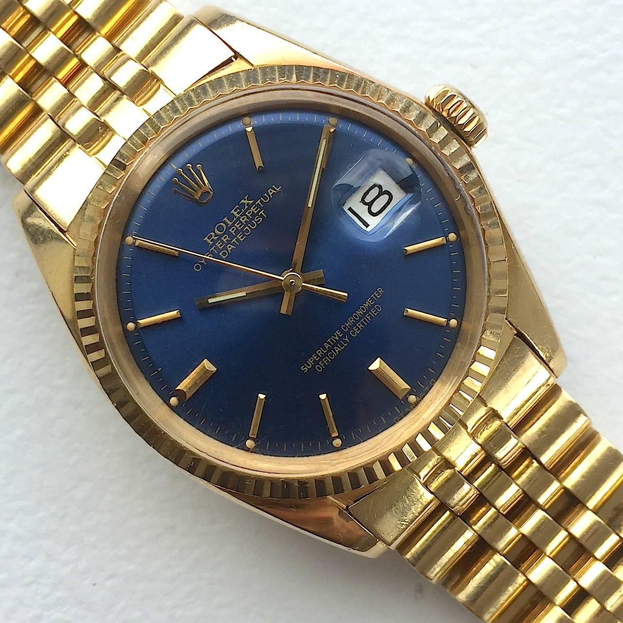 Rolex 18K Yellow Gold Oyster Perpetual Datejust Watch
Beautiful Factory Blue Sigma Dial with Applied Yellow Gold Hour Markers
Yellow Gold Gold Fluted Bezel
18K Yellow Gold Case
36mm in size 
Features Rolex Automatic Movement with Calibre 1500