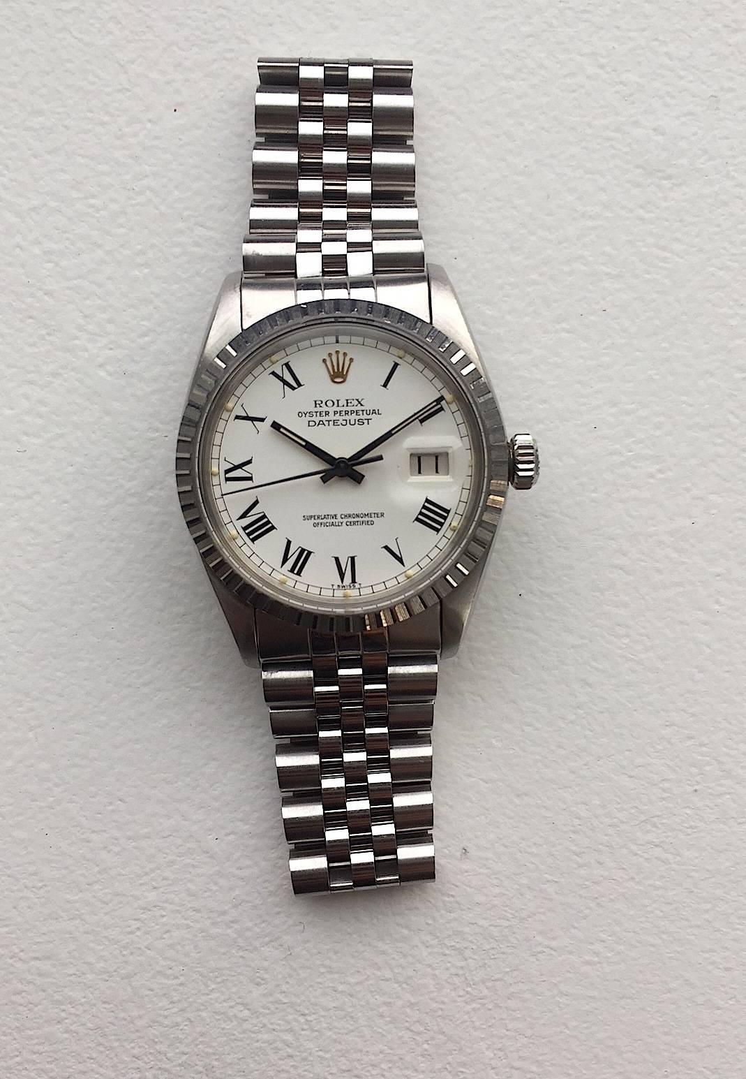 Rolex Stainless Steel Oyster Perpetual Datejust Quickset Wristwatch
Beautiful Factory White Buckley Dial with Black Roman Numerals and Matching Black Hands
Stainless Steel Engine Turned Bezel
Stainless Steel Case
36mm in size 
Features Rolex