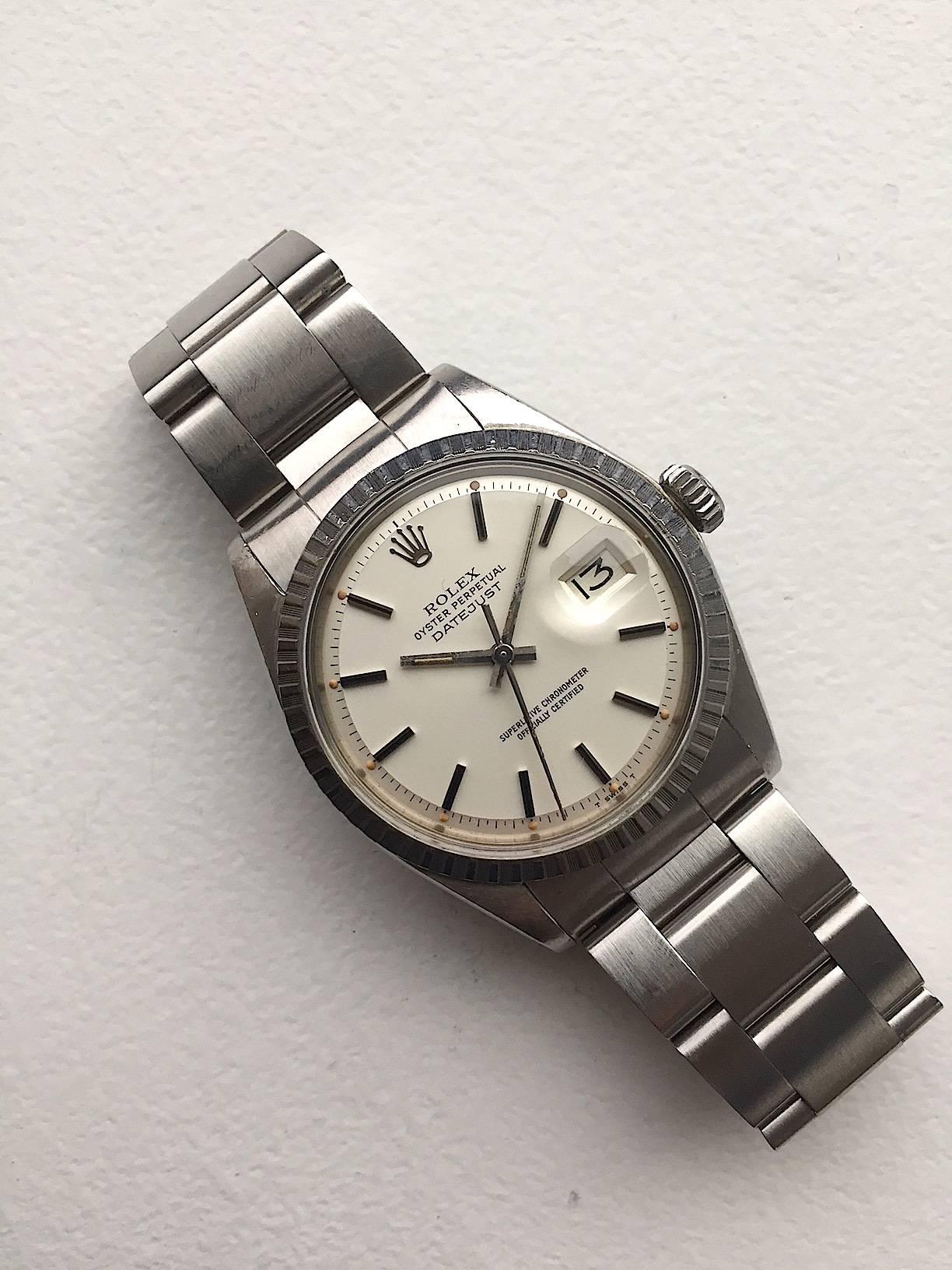 Rolex Stainless Steel Oyster Perpetual Datejust Wristwatch
Beautiful Factory Oyster (Silver) Mirror Dial with Applied Hour Markers and Lume Plots With a Pumpkin Color 
Stainless Steel Engine-Turned Bezel
Stainless Steel Case
36mm in size 
Features
