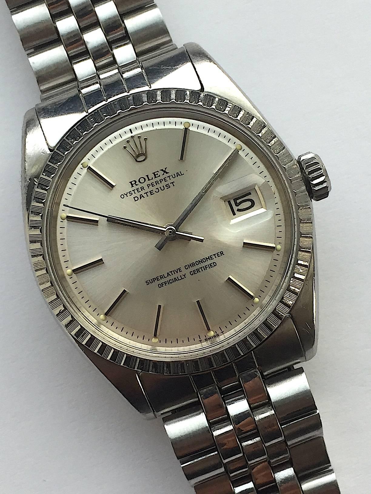 Rolex Stainless Steel Oyster Perpetual Datejust Wristwatch
Factory Silvered Dial with Applied Stick Hour Markers
Stainless Steel Engine-Turned Bezel
36mm in size 
Rolex Calibre Base 1500 Base Automatic Non-QuickSet Movement
Acrylic Crystal
1960's