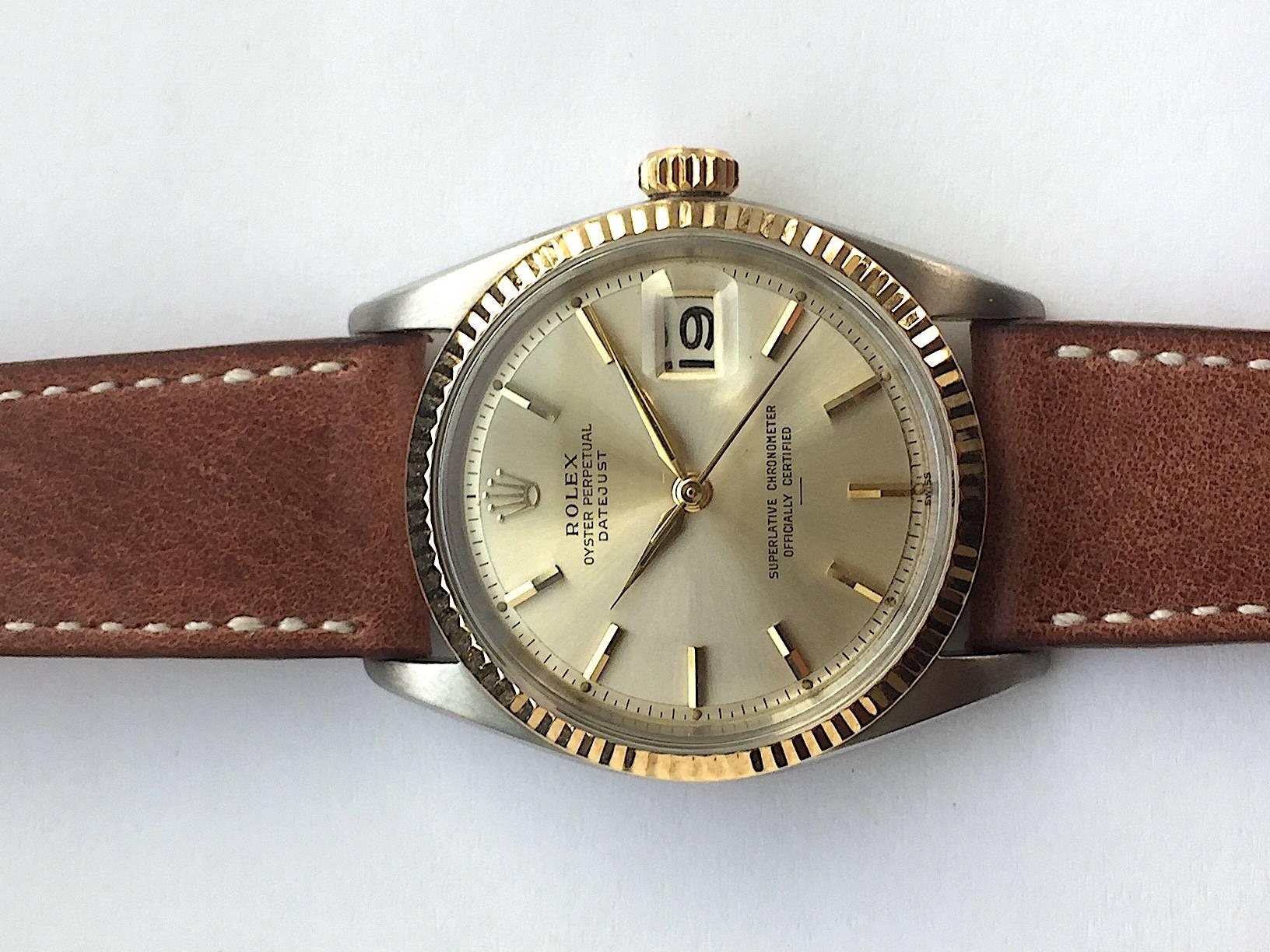 Rolex Stainless Steel and Yellow Gold Oyster Perpetual Datejust Watch
Factory 'Swiss' Only Dial with Underline Marking Corresponding to Early 1960s Production
Yellow Gold Fluted Bezel
36mm in size 
Dauphine Hands
Rolex Calibre Base 1500 Automatic