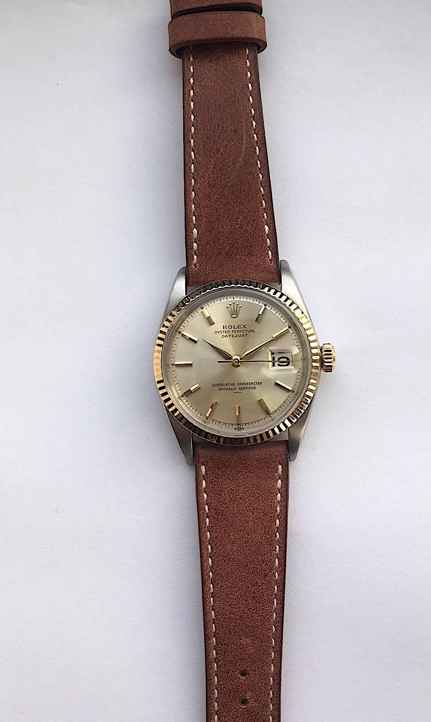 Rolex Stainless Steel and Yellow Gold Oyster Perpetual Datejust Watch
Factory 'Swiss' Only Dial with Underline Marking Corresponding to Early 1960s Production
Yellow Gold Fluted Bezel
36mm in size 
Dauphine Hands
Rolex Calibre Base 1500 Automatic
