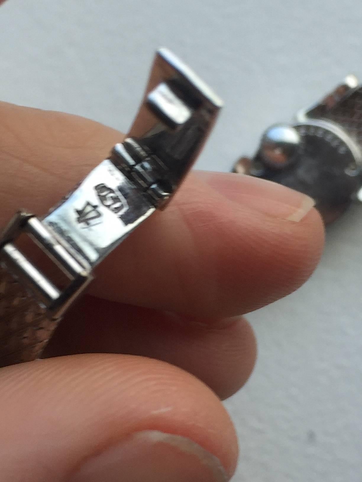 Jaeger LeCoultre 18K White Gold and Diamond Manual Wind Ladies Dress Watch
Silver Toned Dial with Applied Hour Markers
Factory Diamond Bezel and Lugs
Manual Wind Movement 
18K White Gold Integrated Bracelet 
Screw is On Back of The Watch
Fits Up To