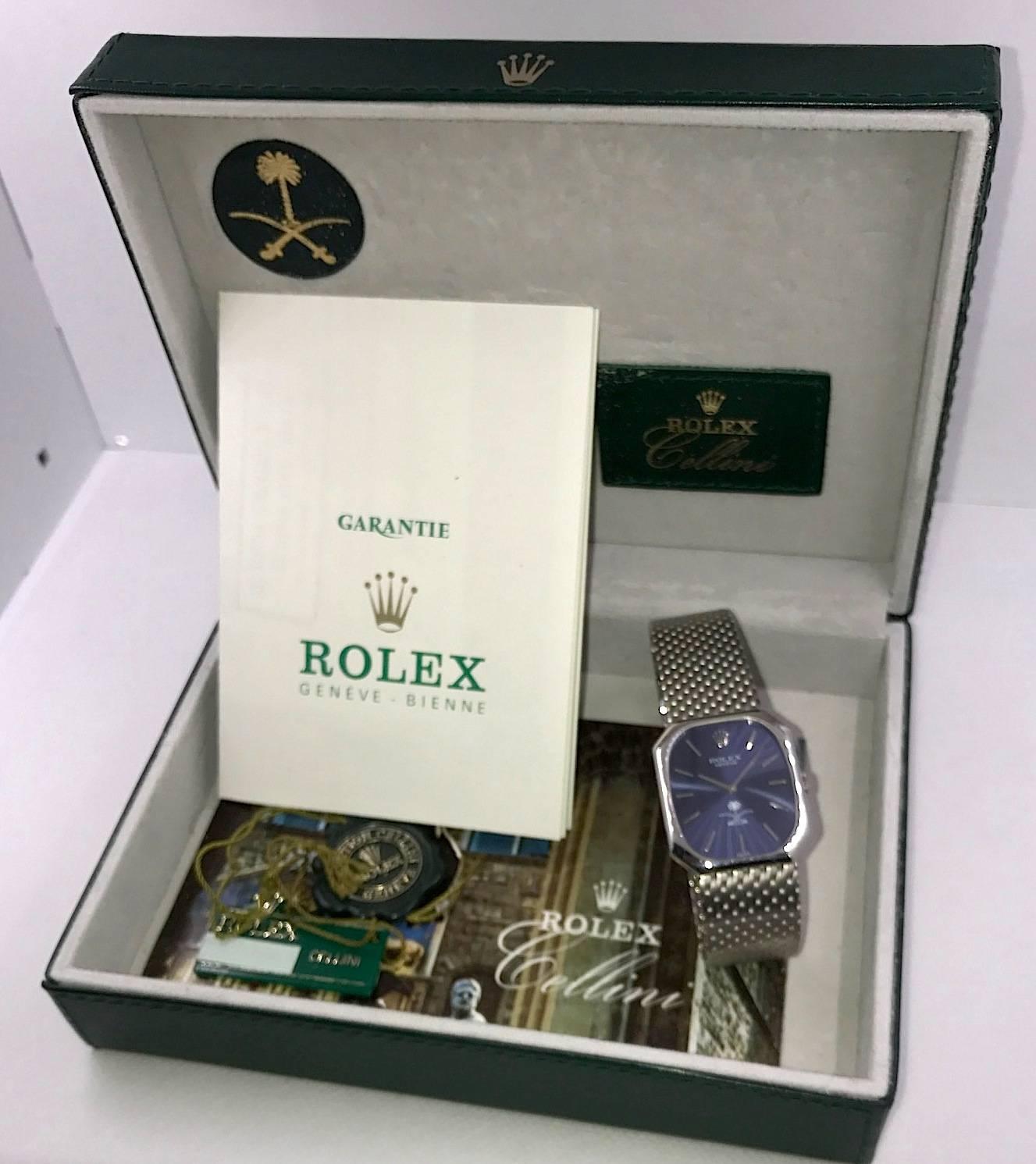 Rolex Cellini 18K White Gold Manual Wind Wristwatch
Factory Blue Gloss Dial with Saudi Arabia Logo
Rare Edition Sold Only in Saudi Arabia 
18K White Gold Smooth Bezel
27mm x 32mm
Rolex Manual Wind Movement
Sapphire Crystal
Original Sticker is Still