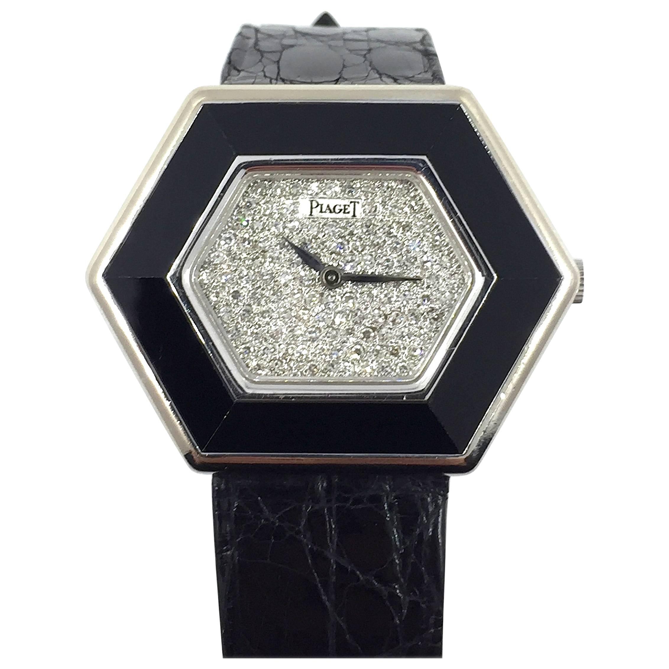 Piaget 18K White Gold Manual Wind Wristwatch
Factory Pave Diamond Dial Accented by Onyx Inlaid Bezel
26mm x 35mm
Piaget Manual Wind Movement
Sapphire Crystal
Comes Fitted on Original Piaget Leather Strap with Piaget 18K White Gold Buckle
Includes