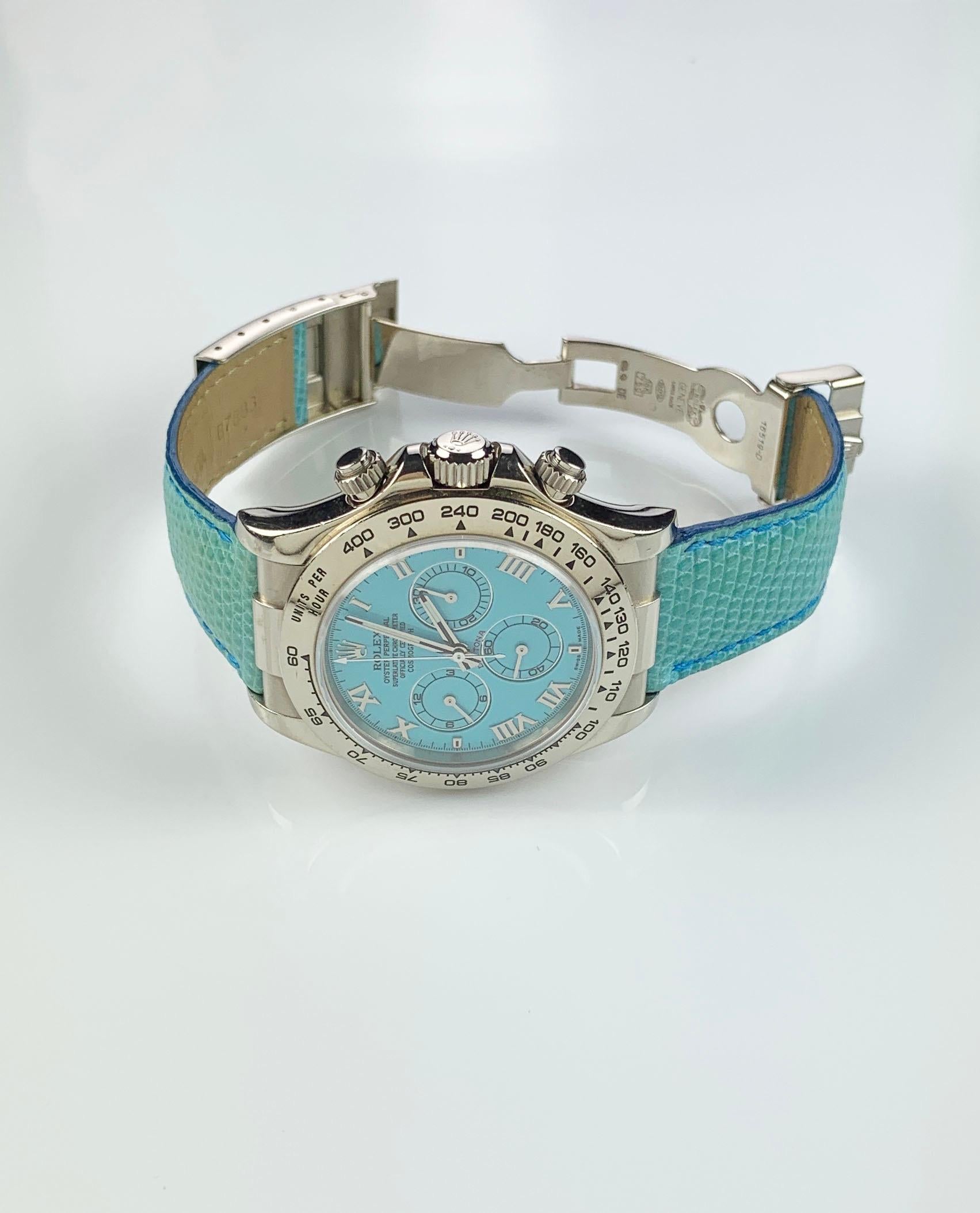 Rolex 18K White Gold Oyster Perpetual Cosmograph Daytona Wristwatch
Rare Factory Blue Turquoise Dial with Three Sub-Dials
18K White Gold Bezel Which Shows Wear and Some Use
40mm in size 
Rolex Calibre 4130 Automatic Chronograph Movement
Sapphire