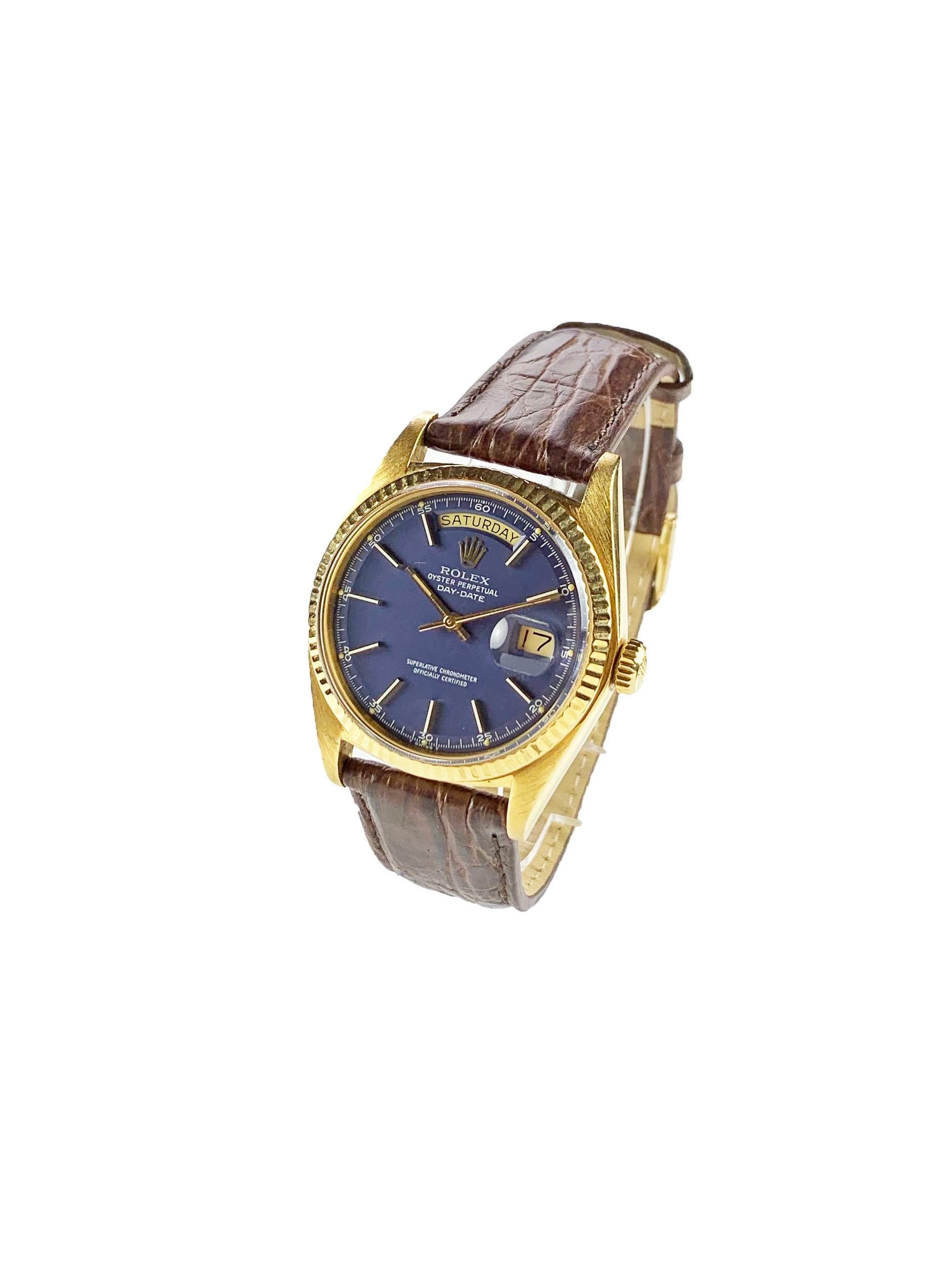 Rolex 18K Yellow Gold Day-Date Presidential Watch from the Early 1970's
Beautiful Factory Blue Minute Track Dial with Quarter Markers and Stunning Luminous Plots.
Yellow Gold Gold Fluted Bezel
18K Yellow Gold Case
36mm in size 
Features Rolex