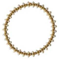 1970s french 18k gold “rope” and pearl necklace.