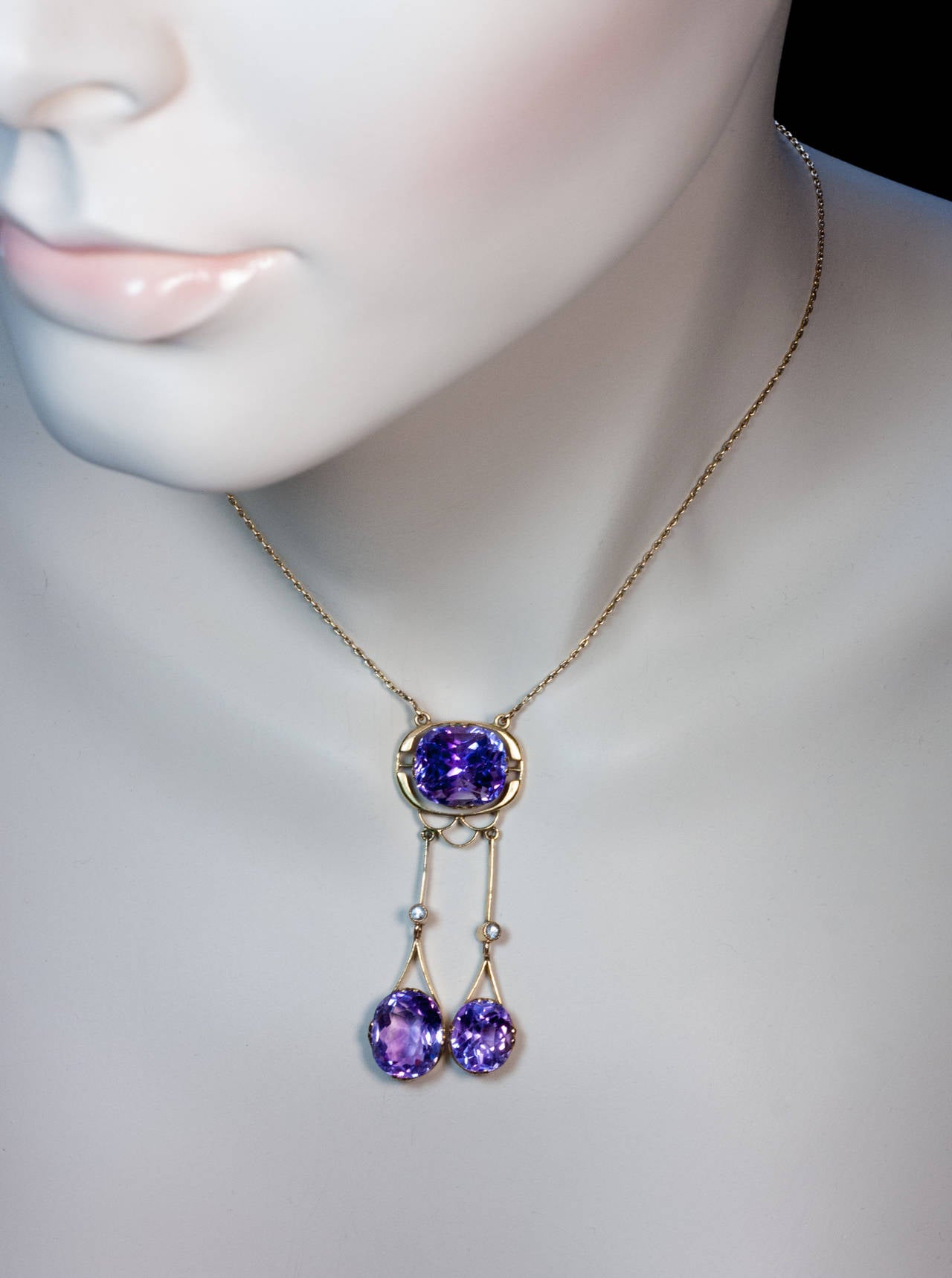 Made in Moscow between 1908 and 1917

14K gold, three sparkling Russian Siberian amethysts, two rose cut diamonds

Marked with maker's initials and 56 zolotnik gold standard

length 52 mm (2 1/8 in.)