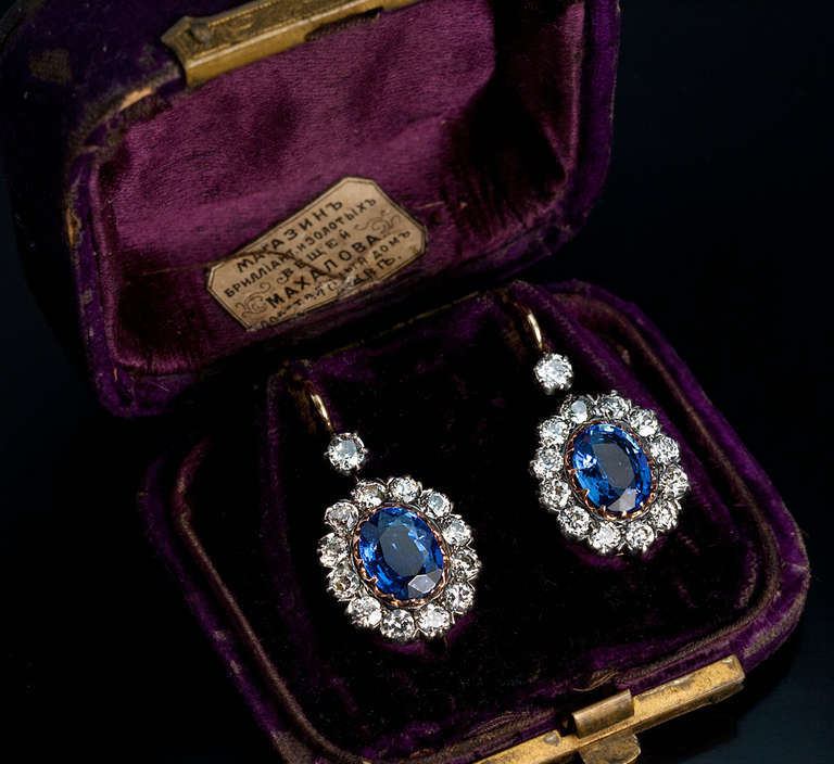 A pair of sapphire and diamond cluster earrings, circa 1915, crafted in silver and 14K rose gold. 26 old European diamonds have an estimated total weight of 3 carats. Appoximate total weight of the sapphires - 4.32 ct. Original velvet