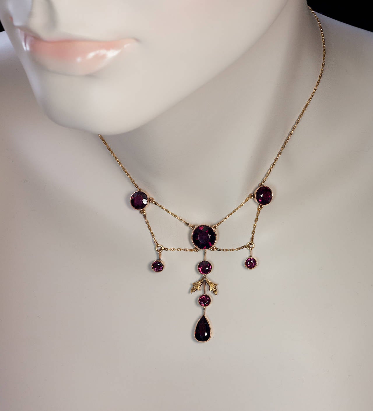 Edwardian era 14K gold and almandine garnet necklace

Russian, made in Odessa between 1908 and 1917

Marked with 56 zolotnik standard and maker's initials