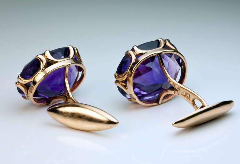 a pair of 14K gold cufflinks set with oval faceted amethysts (estimated total weight 25.70 ct)

made in the city of Kazan between 1908 and 1917

marked with maker's initials and 56 zolotnik standard

width 18 mm (3/4 in.)