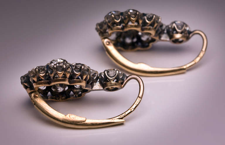 St. Petersburg, 1908-1917

silver topped 14K gold earrings set with over 6 carats of sparkling bright white (mostly E-F color) old European and old cushion cut diamonds 

marked with maker's initials and 56 zolotnik standard