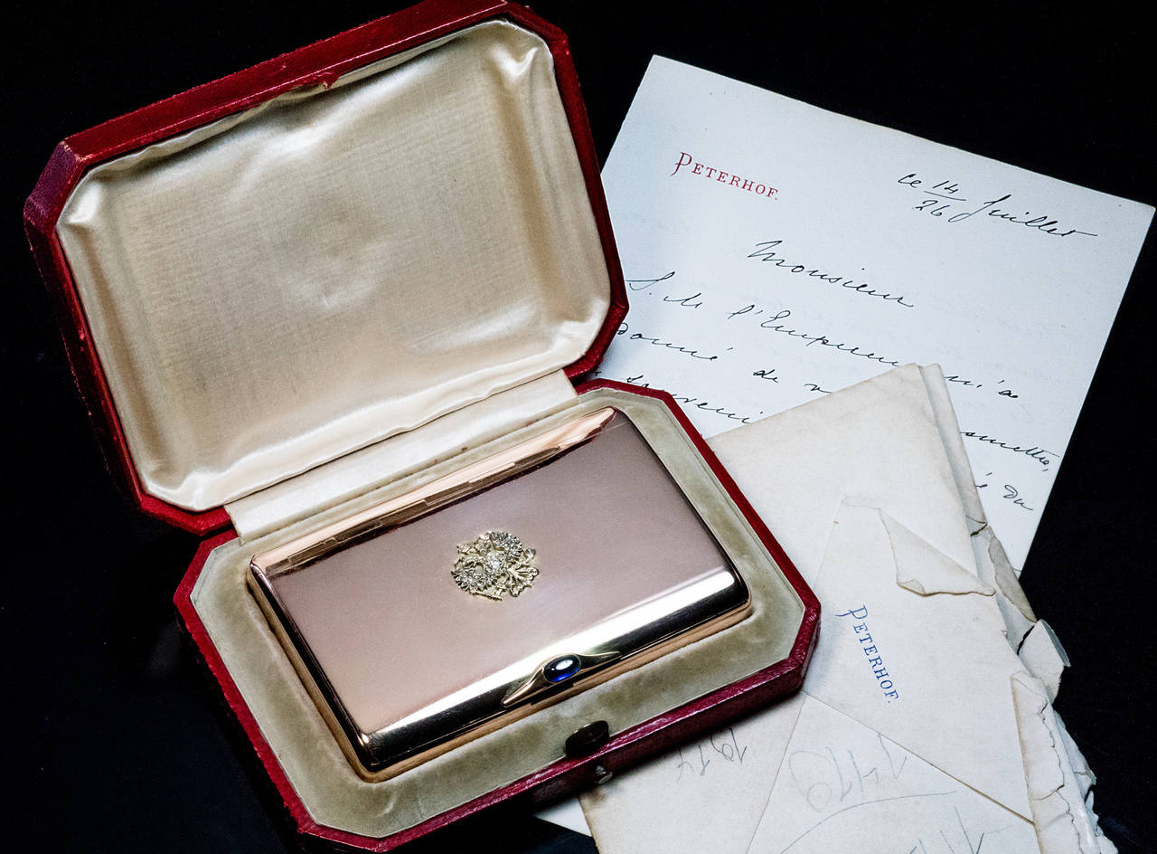 A Faberge Russian Imperial Presentation Gold Cigarette Case

Given by Tsar Nicholas II in 1896

A historically important and well documented Imperial object directly related to Tsar Nicholas II and his coronation

The cover of the 14K polished