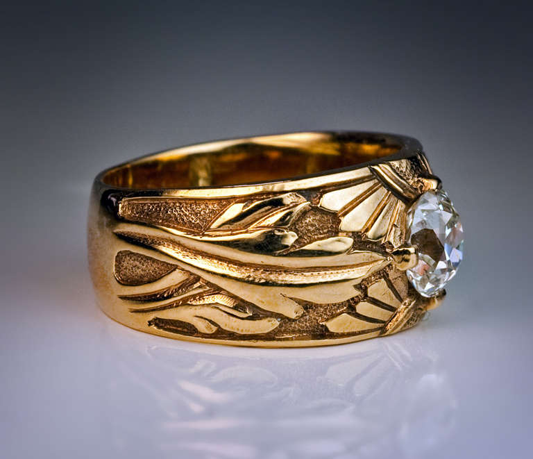 Made in Moscow between 1908 and 1917

The ring is cast and chased with floral designs in the Russian Modern style of the 1910s.

14K yellow gold, one antique cushion cut diamond (5.95 x 5.45 x 4.1 ct, estimated weight 1.1 carat, I color, SI1