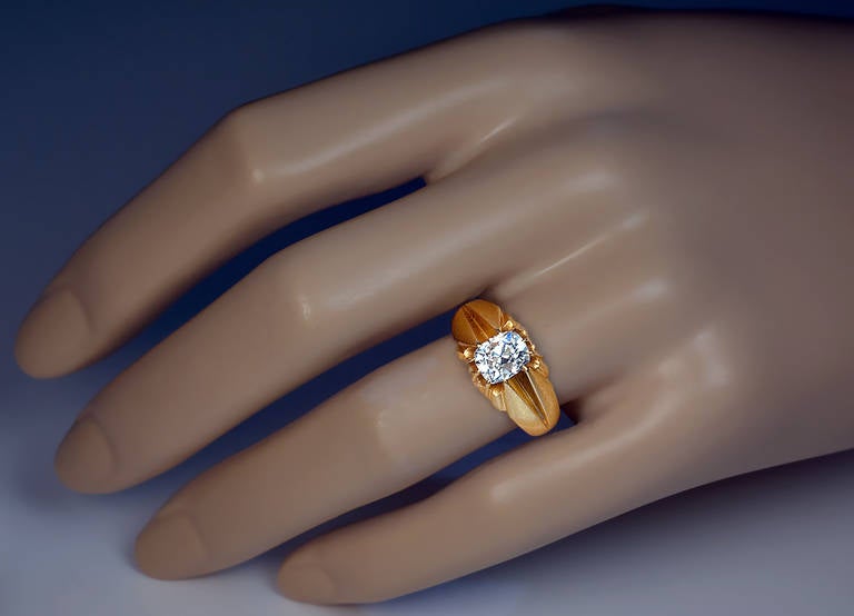 Made in Odessa between 1908 and 1917.

A matte 14 gold ring set with an antique cushion cut diamond (6.85 x 5.7 x 4.8 mm) approximately 1.45 ct,  D color, VS 2 clarity.

Marked with 56 zolotnik standard and maker's initials.

Ring size 8.