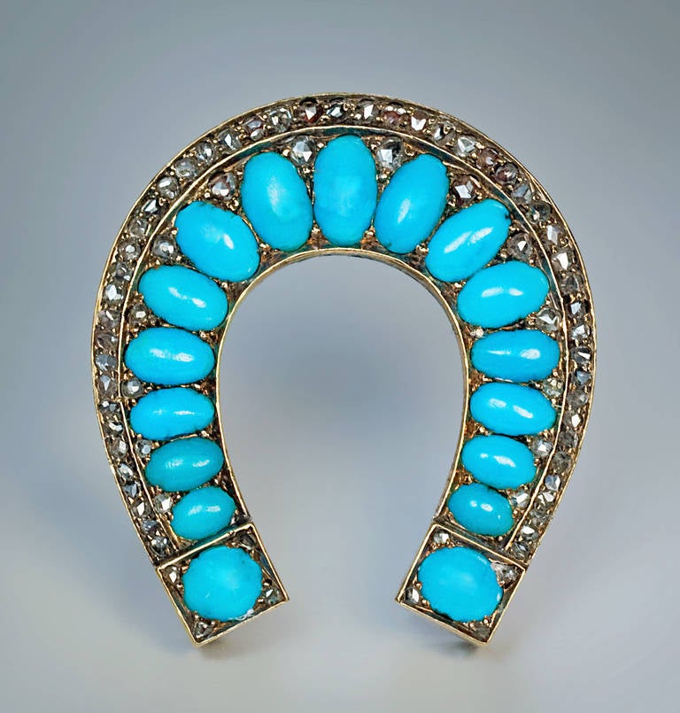 Russian, 1899 - 1908

a horseshoe shaped brooch set with fine Persian turquoise and rose cut diamonds

marked with 56 zolotnik gold standard (14K) for the period 1899-1908 and later Soviet control marks from the 1930s

 Height  34 mm (1 5/16