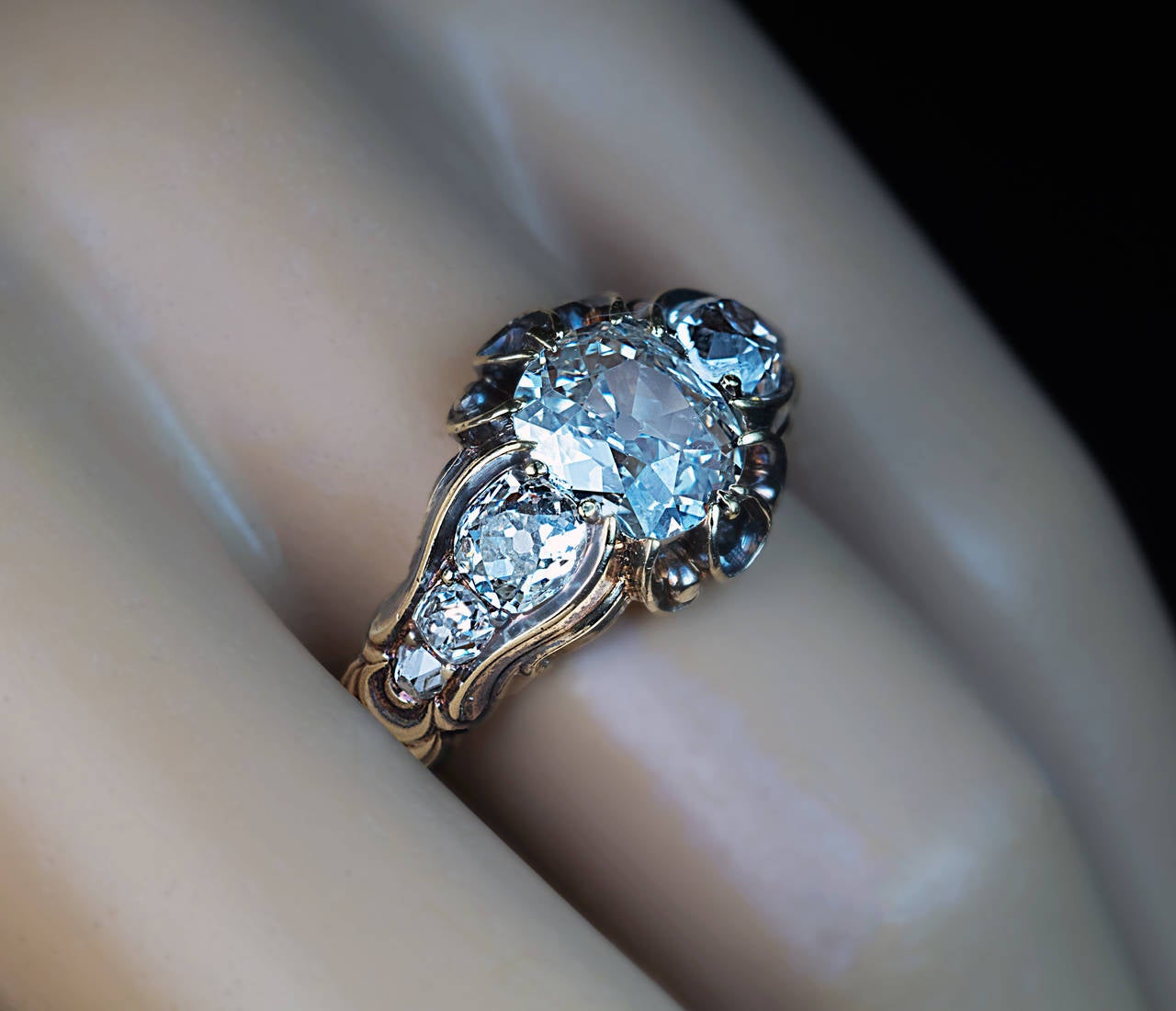 circa 1850

a unisex 7 stone diamond ring centered with an antique cushion cut diamond
8.1 x 7.2 x 3.4 mm, approximately 1.53 ct, I color, SI1 clarity

size 9
