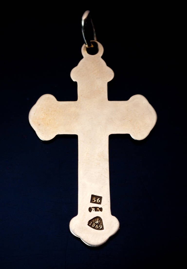 a 14K gold and painted enamel cross pendant made in St. Petersburg in 1869, 41 x 29 mm, marked with 56 zolotnik gold standard, maker's initials, St. Petersburg assay stamp with date '1869'