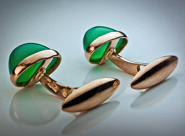 made in Odessa between 1908 and 1917

14K gold cufflinks set with oval cabochon cut bluish-green chrysoprases (a variety of chalcedony gemstones)

marked with 56 zolotnik old Russian gold standard and maker's initials

Width 13 mm (1/2 in.)