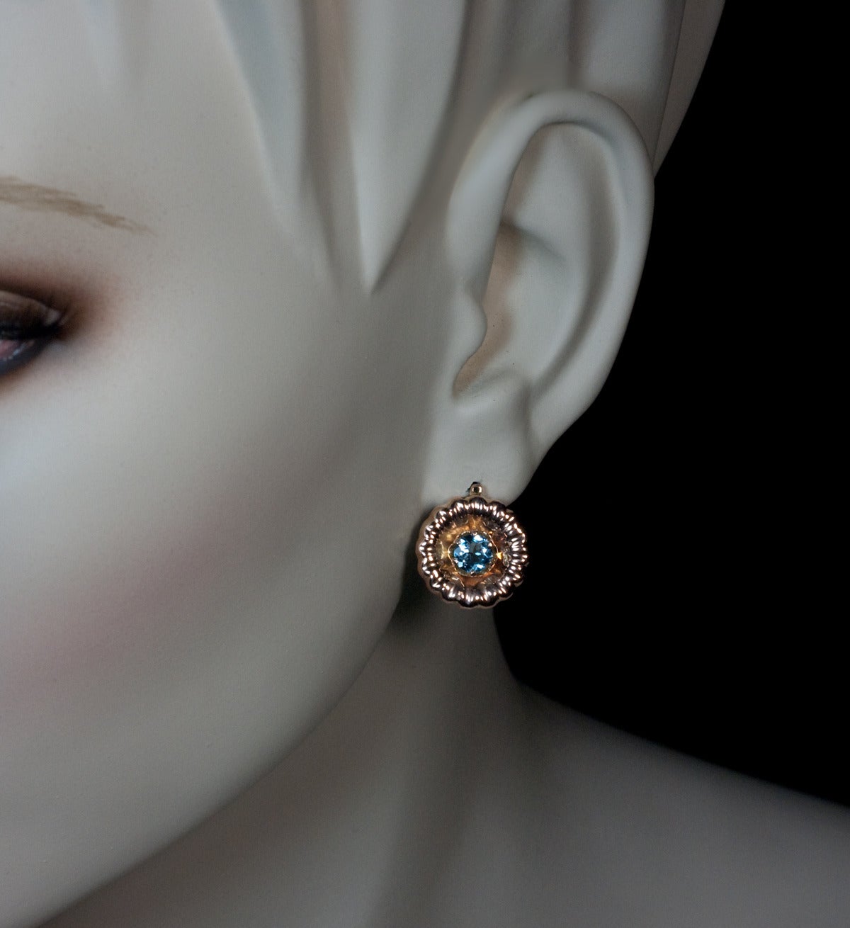 Russian, early 1900s

Designed as stylized flower heads centered with prong-set round aquamarines

14K rose gold, marked with maker's initials
