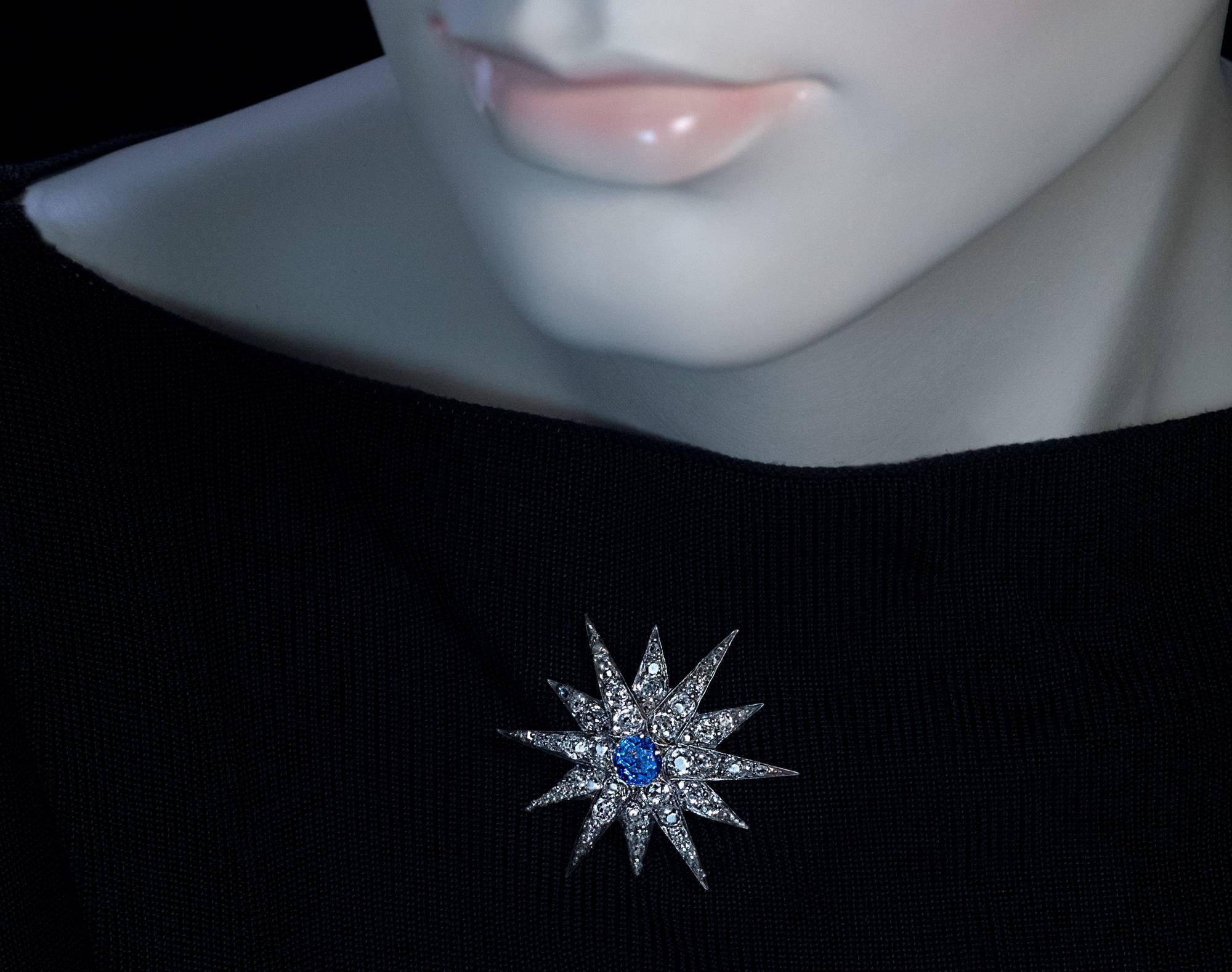 Russian hallmarks, made between 1899 and 1908

The twelve pointed star with a raised center is handcrafted in silver and gold.

The star is centered with a round blue sapphire (approximately 1.34 ct).  

The rays of the star are densely set