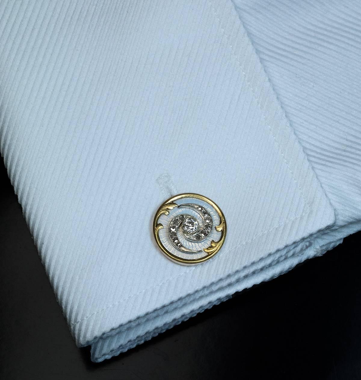 made in St Petersburg between 1908 and 1917

a pair of superb Imperial era cufflinks of a tourbillon design, embellished  with old European and old rose cut diamonds and exceptional quality bluish-white guilloche enamel

marked with St