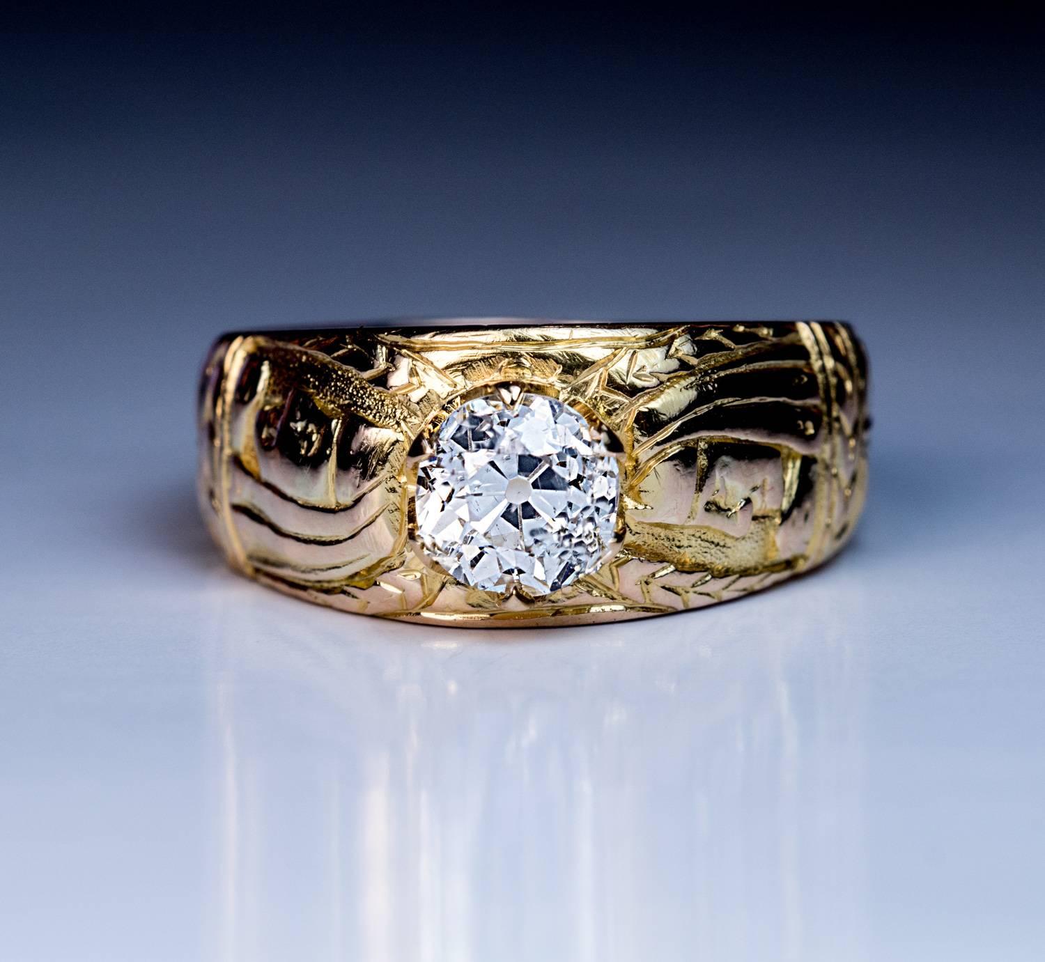 Circa 1890

This highly unusual antique 14K gold ring is chased with two profile busts of an Egyptian pharaoh and stylized floral designs.

The ring is prong set with a sparkling old European cut diamond (J color, SI2 clarity, 6.4-6.3 x 4.3 mm,