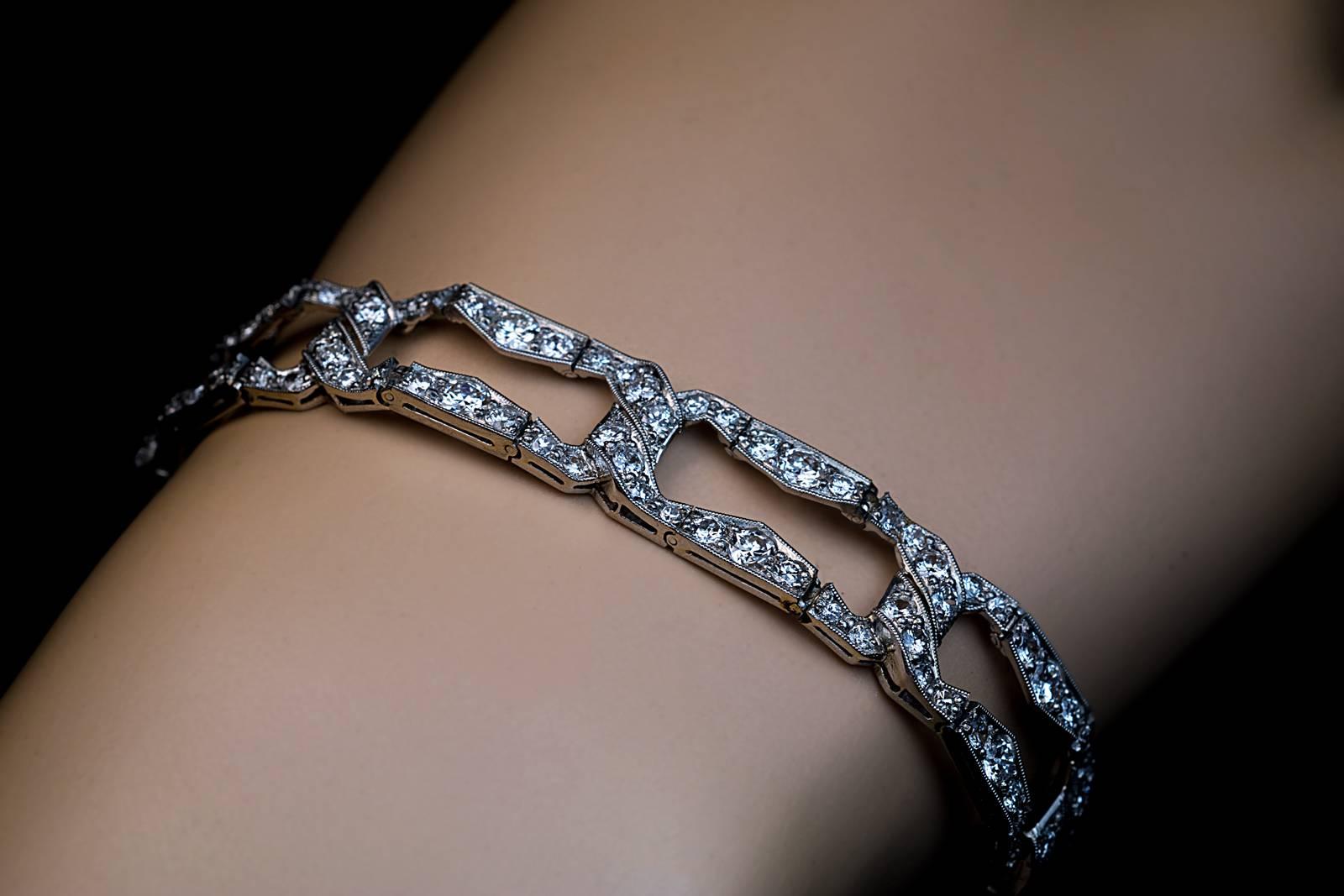 An elegant open link milgrain bracelet is hand-crafted in 950 platinum and densely set with sparkling bright white transitional cut brilliant diamonds.

Circa 1930s

Marked on clasp ‘950 Pt.’

Length 18.6 cm (7 5/16 in.)

Width 12 mm (1/2