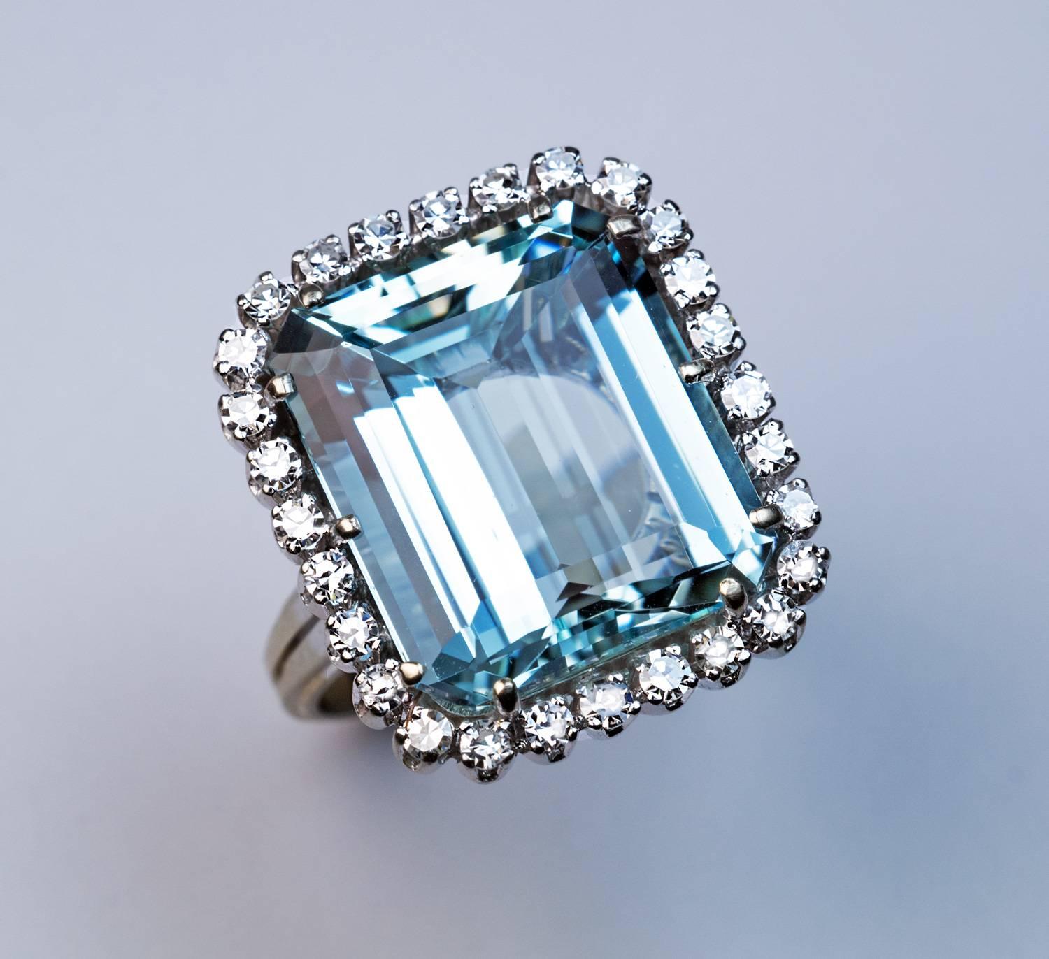 Circa 1950s

A mid-century 18K white gold cluster ring features a superb cool blue step-cut aquamarine (16.1 x 13.9 x 7.5 mm) surrounded by 28 bright white single-cut diamonds.

Aquamarine 12.55 ct.

Estimated total diamond weight 0.60