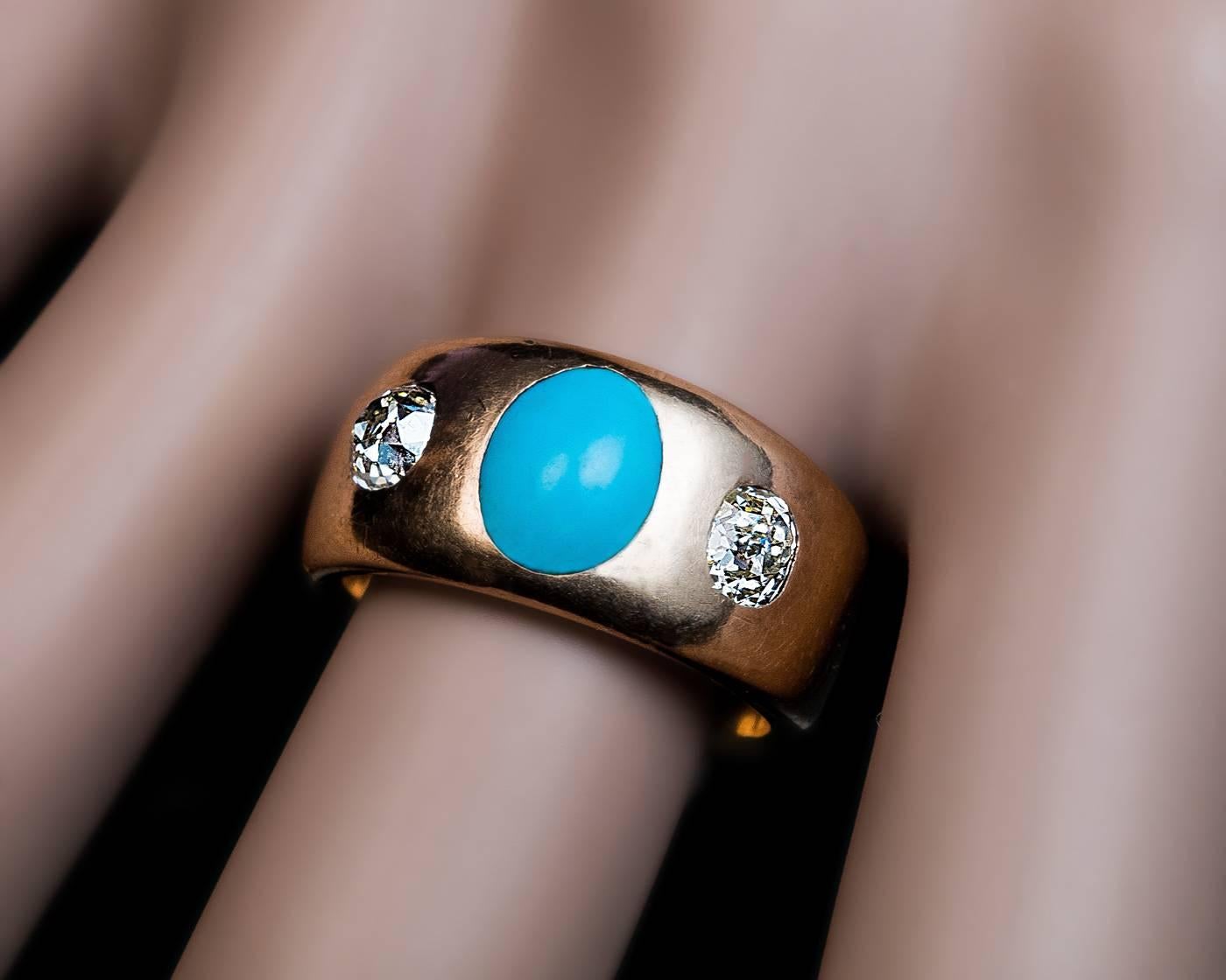 Russian, made in St. Petersburg between 1882 and 1898

An antique Victorian era 14K gold Gypsy ring is centered with a cabochon Persian turquoise flanked by two sparkling old cushion cut diamonds:

4.4 x 4 x 3 mm, approximately 0.45 ct.

4.5 x