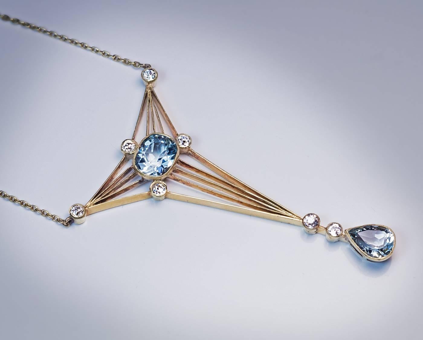This elegant early Art Deco pendant necklace was made in Moscow between 1908 and 1917.

The 14K greenish-yellow gold pendant is bezel-set with one cushion cut aquamarine, one drop shaped aquamarine and seven old European cut diamonds.

Estimated