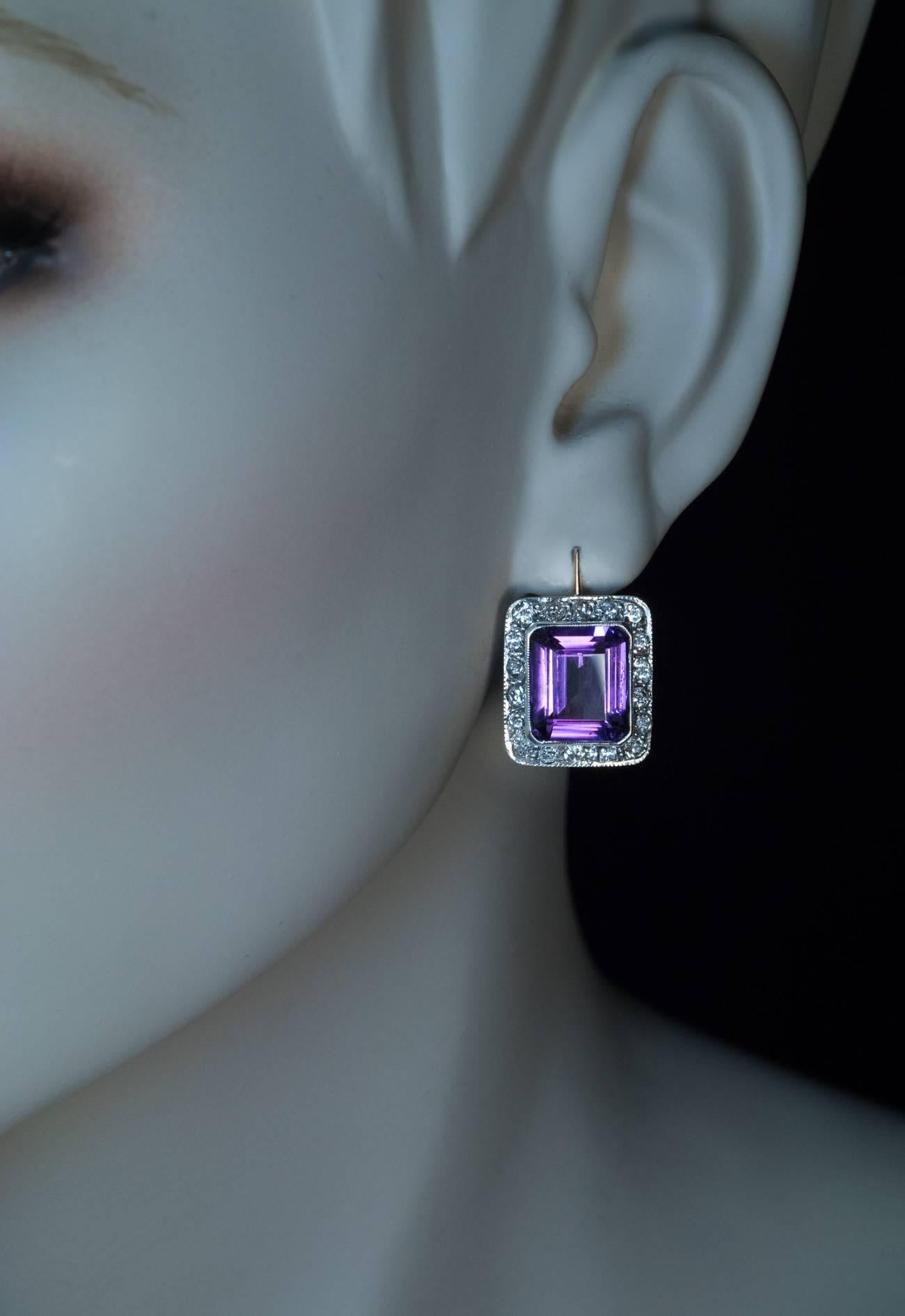 The earrings were made in the 1930s,  in Sverdlovsk, the capital of the Ural Mountains province. They are handcrafted in silver topped 14k gold and centered with emerald cut sparkling lavender-purple Siberian amethysts framed by old mine cut