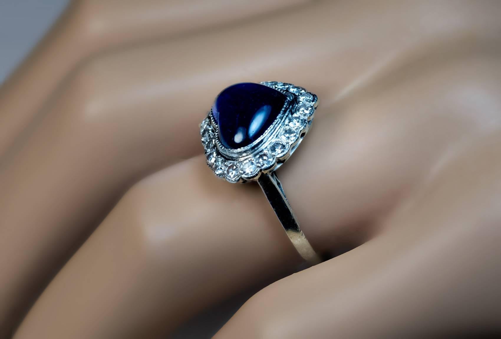 Circa 1930

A platinum ring from Art Deco era features a heart-shaped cabochon cut natural unheated blue sapphire framed by 21 single cut diamonds.

The sapphire is approximately 5 carats.

Estimated total diamond weight 0.63 ct.

Ring size 7.75 (18