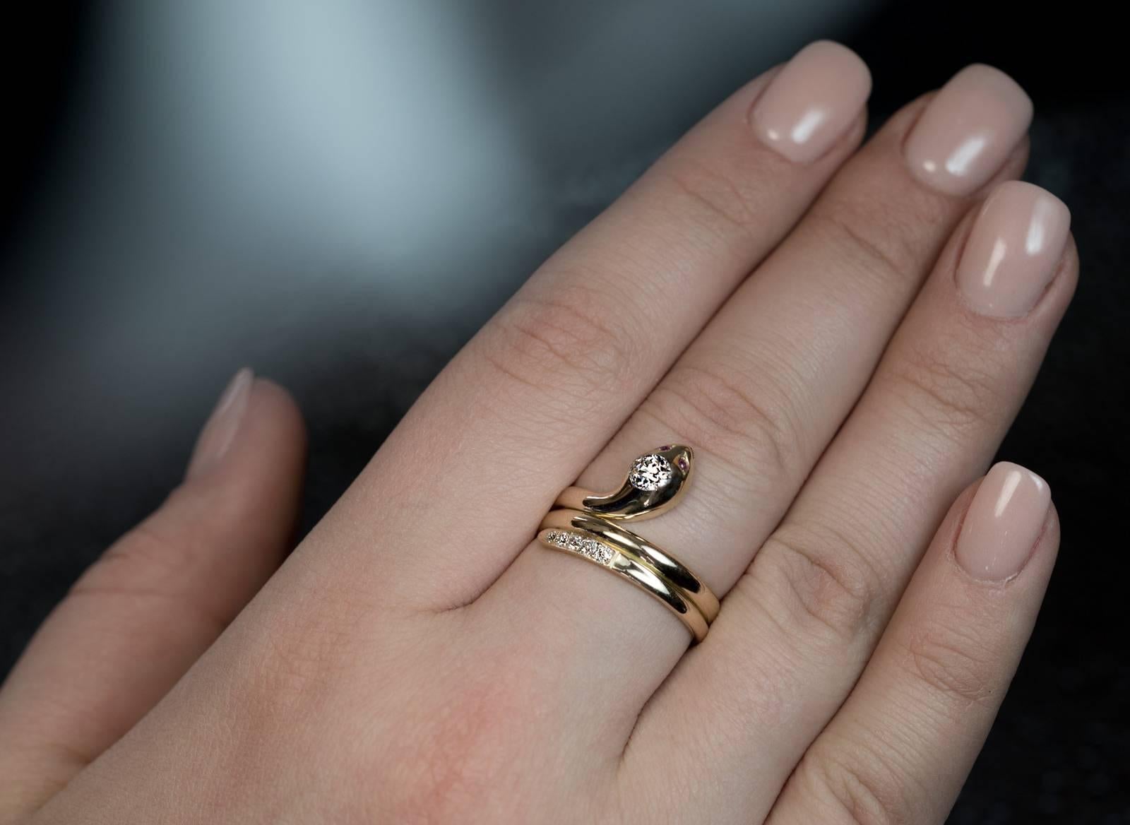 Vienna, Austria, circa 1900
A Victorian era 14K gold ring is designed as a stylized coiled snake. The head of the snake is embellished with a sparkling bright white old European cut diamond (approximately 0.40 ct), the eyes – with cabochon cut