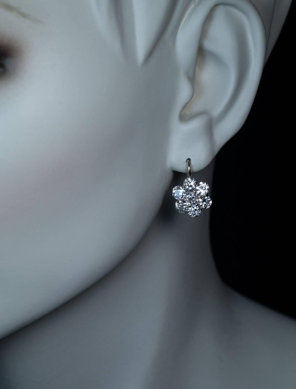 Made in Moscow between 1908 and 1917
A superb pair of antique Russian cluster earrings finely crafted in silver topped 14K gold. The earrings are set with 14 sparkling bright white old European cut diamonds.
The diamonds are of a top quality for